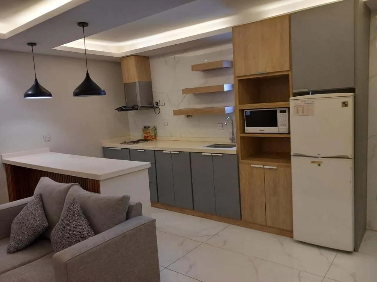 Kitchen or kitchenette in فيجن للشقق المخدومة ــ اقتصادي