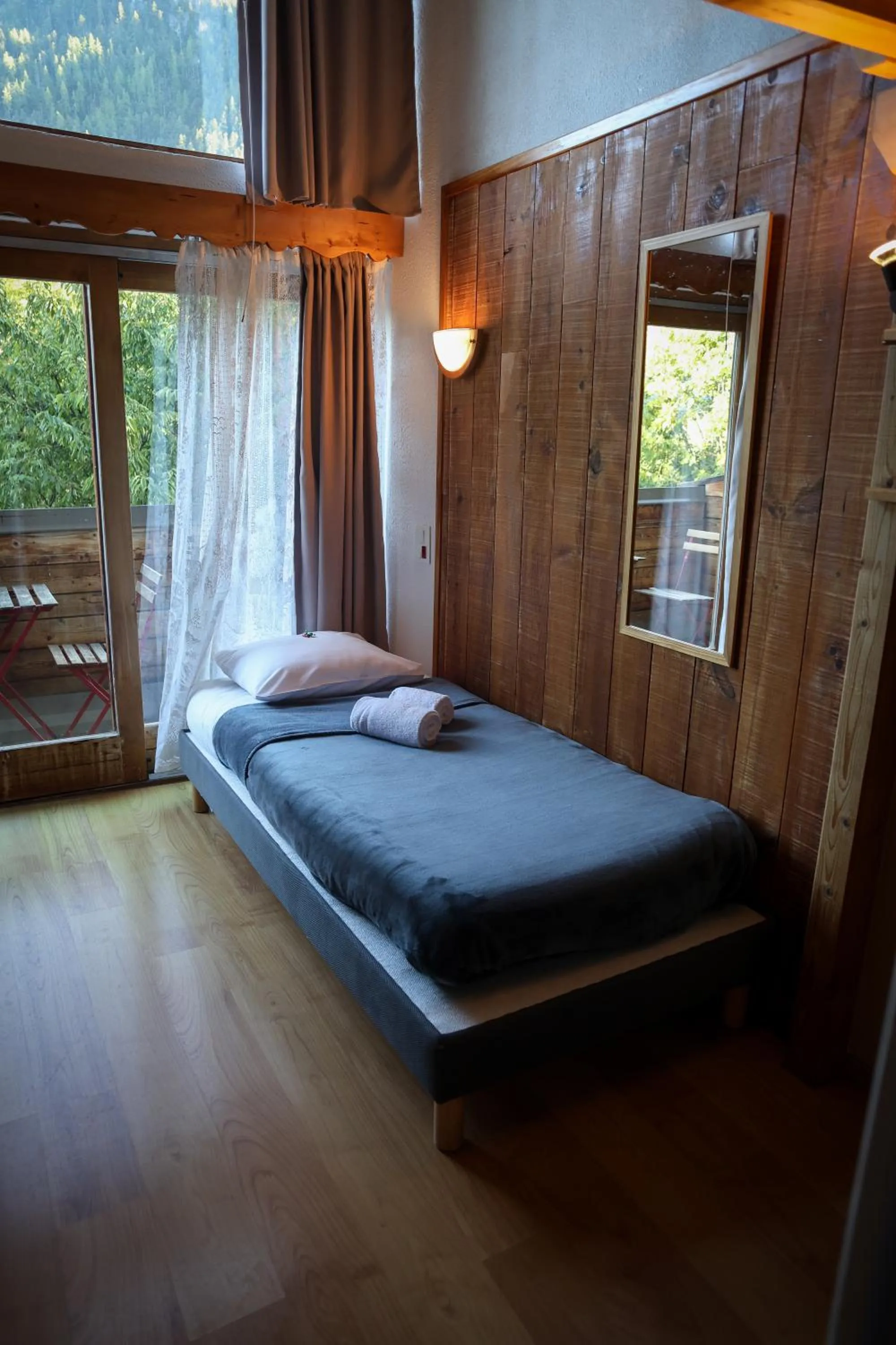 Bed in Hôtel Restaurant Gîtes Les 5 Saisons