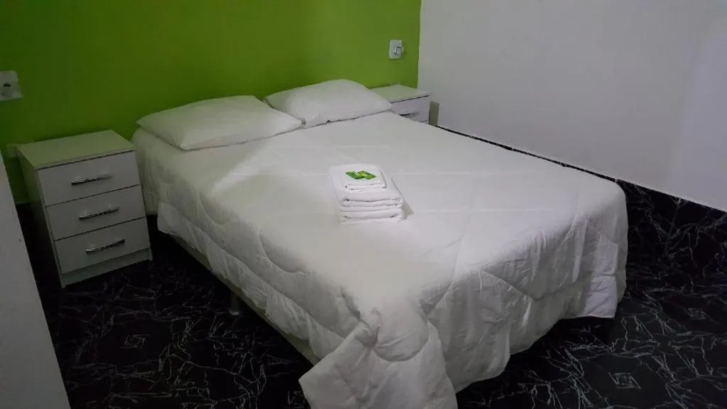 Bed in Pousada Ferradura Beach