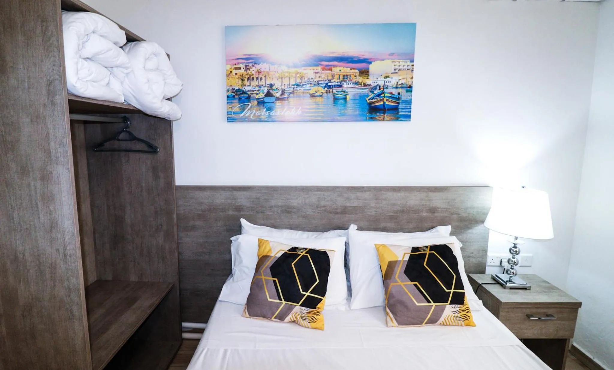 Bed in Napoli Suites Studios Aparthotel