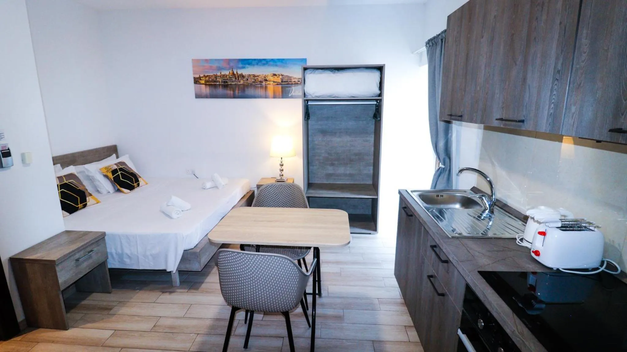 Bed in Napoli Suites Studios Aparthotel