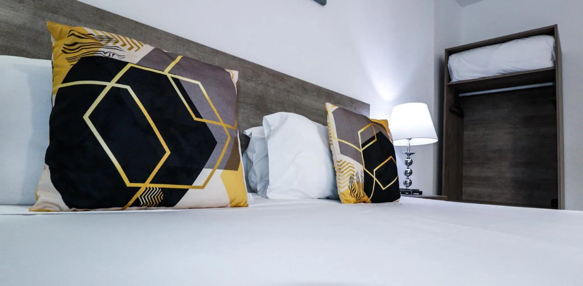 Bed in Napoli Suites Studios Aparthotel