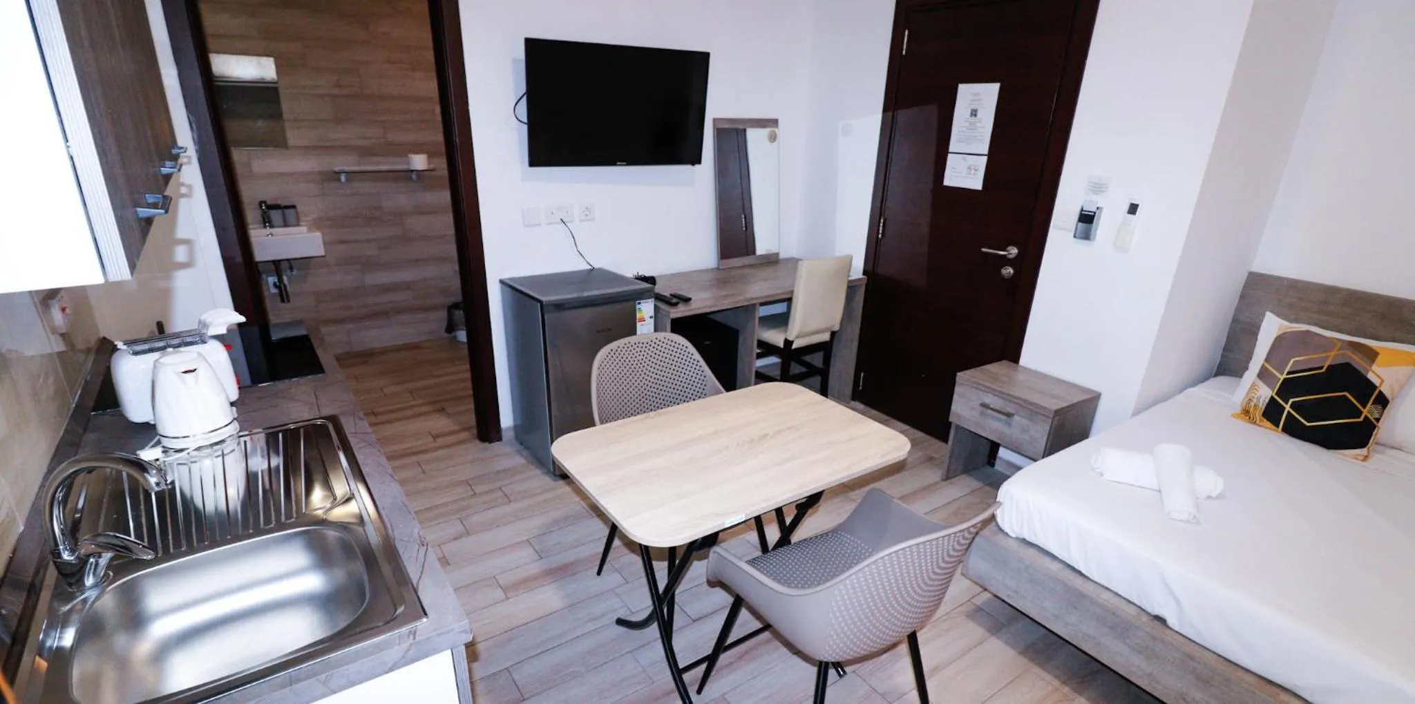 Bed in Napoli Suites Studios Aparthotel