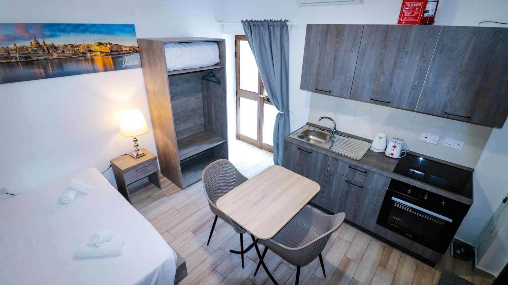 Bed in Napoli Suites Studios Aparthotel