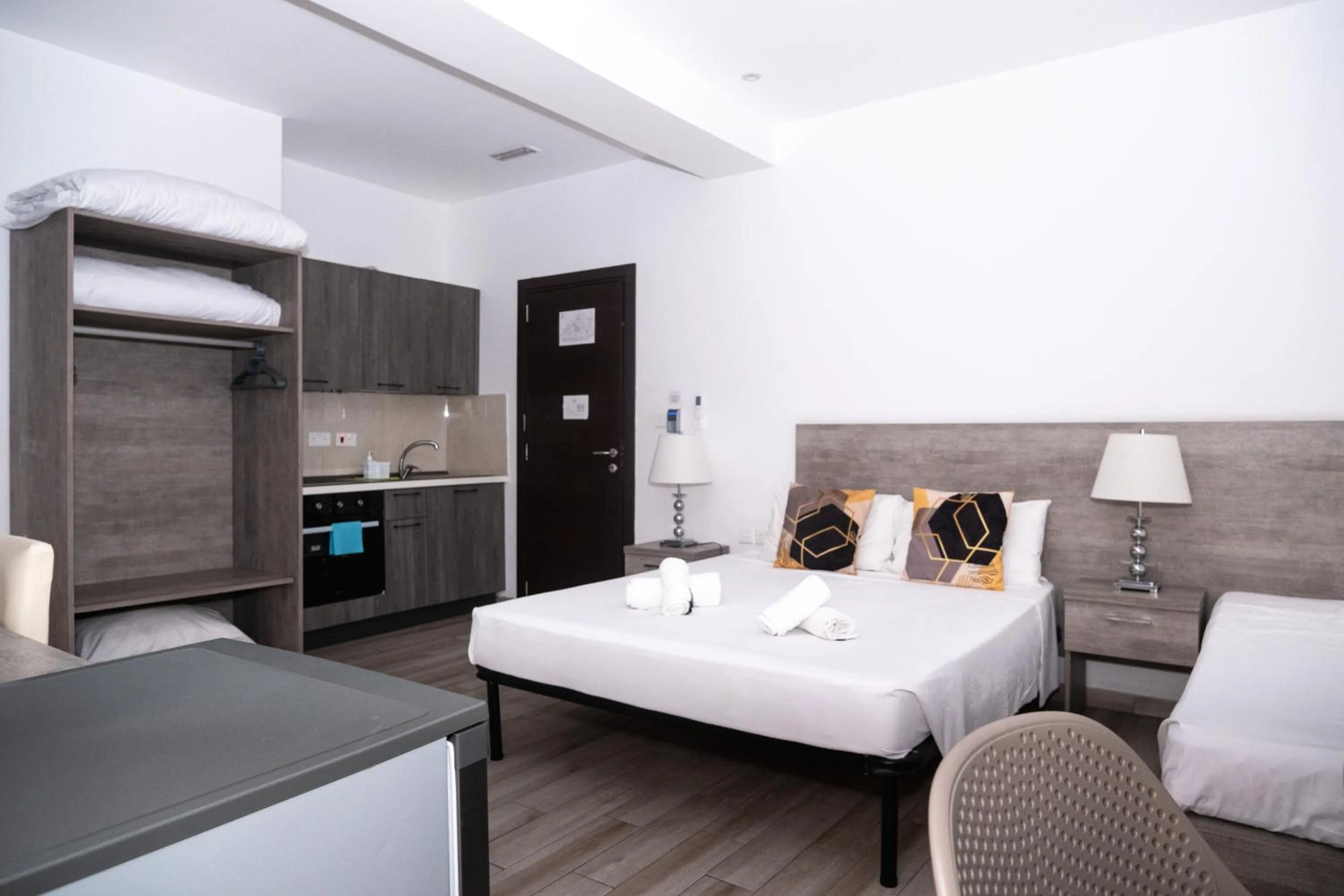 Bed in Napoli Suites Studios Aparthotel