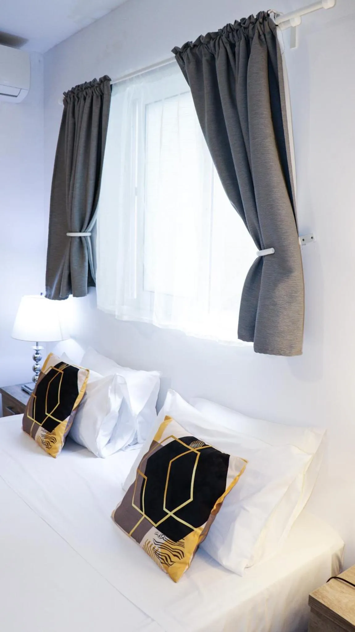 Bed in Napoli Suites Studios Aparthotel