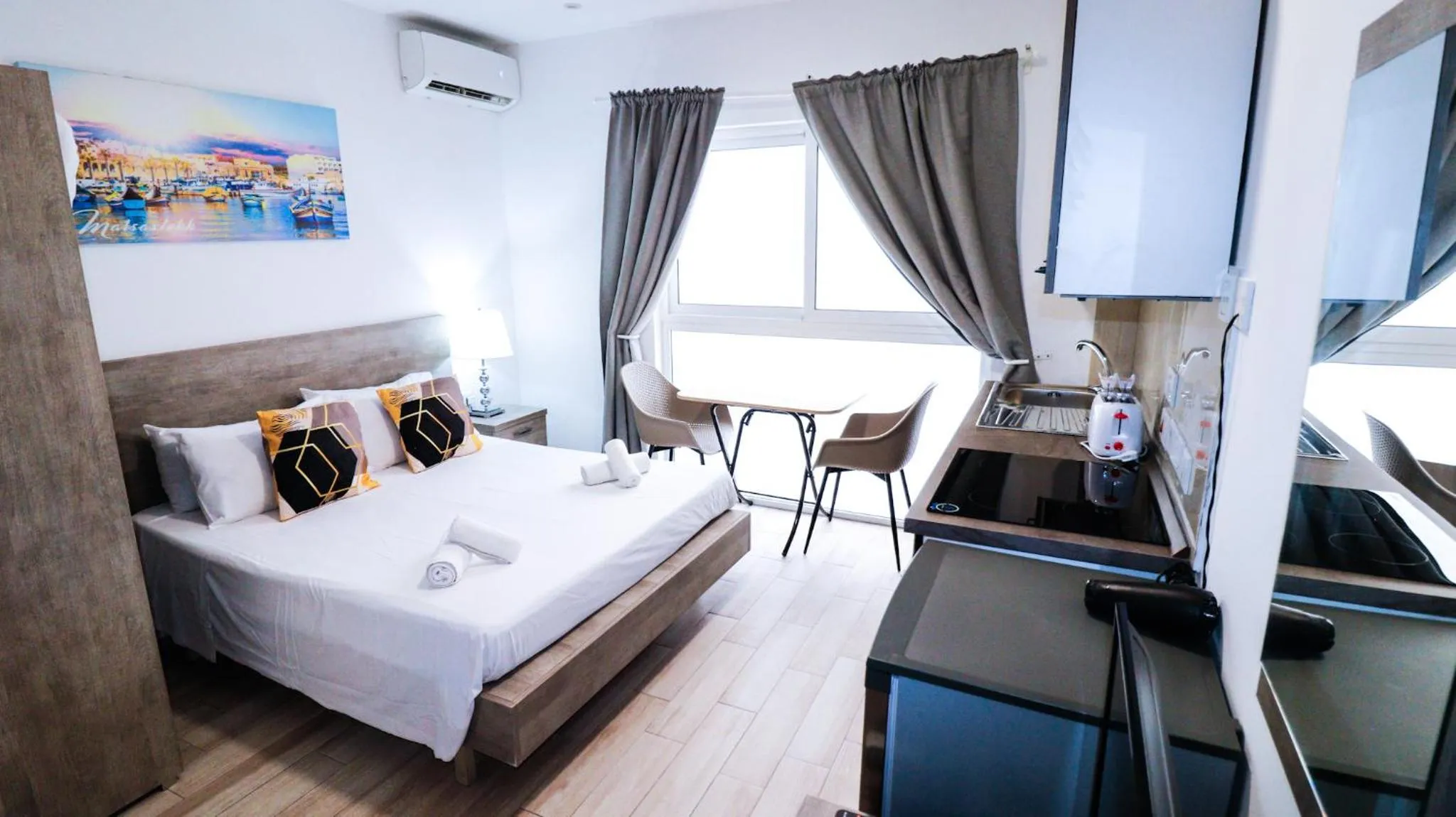 Photo of the whole room, Bed in Napoli Suites Studios Aparthotel