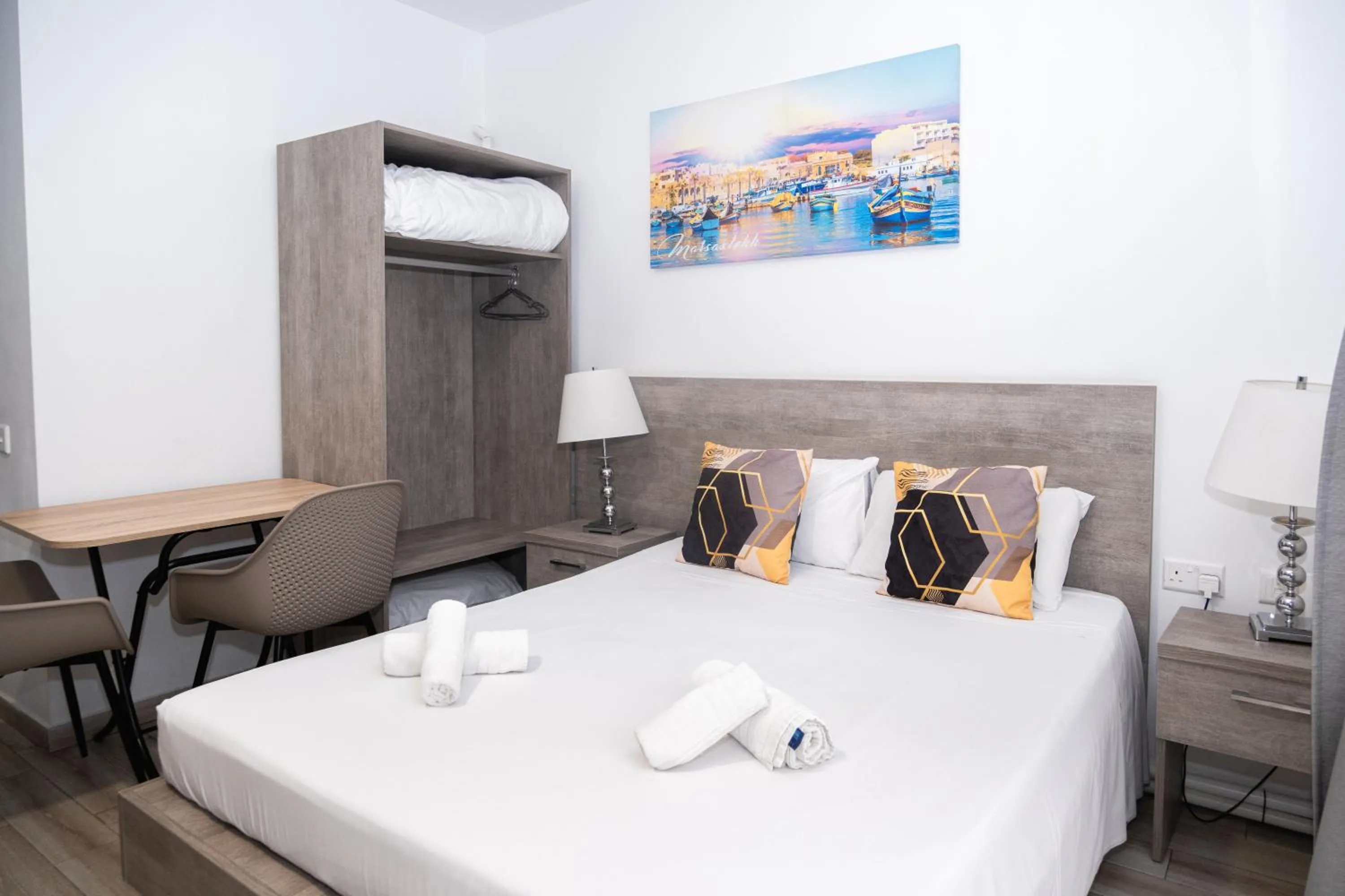 Bed in Napoli Suites Studios Aparthotel