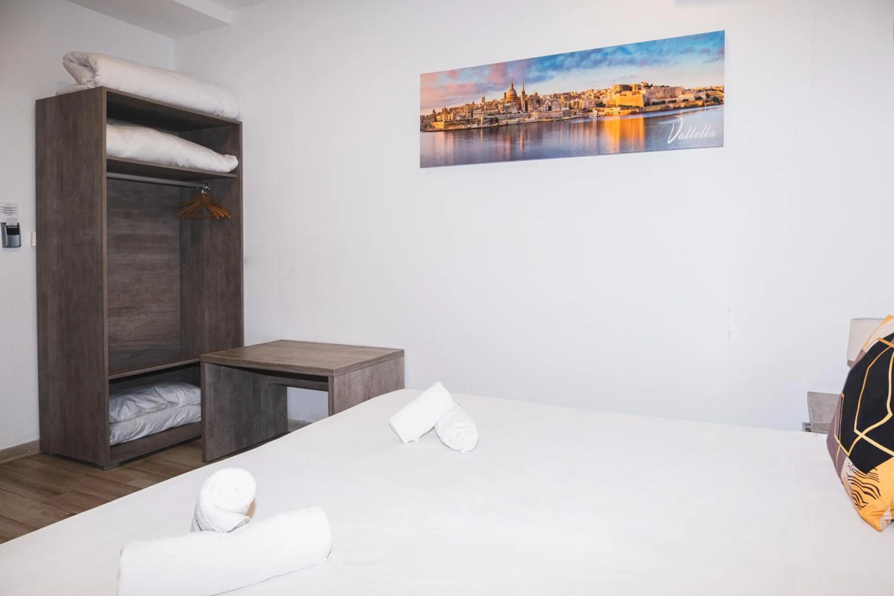 Bed in Napoli Suites Studios Aparthotel