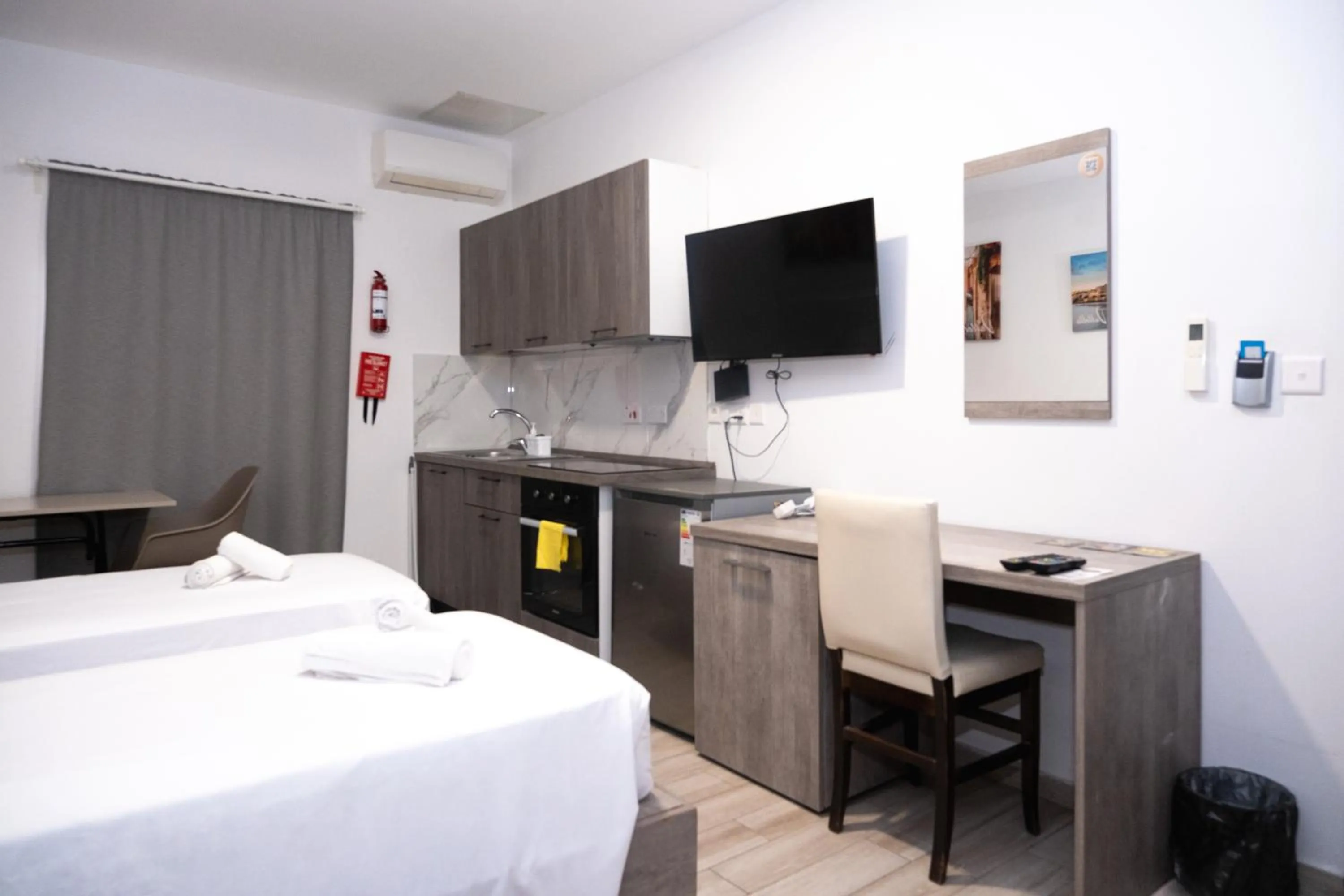 Bed in Napoli Suites Studios Aparthotel