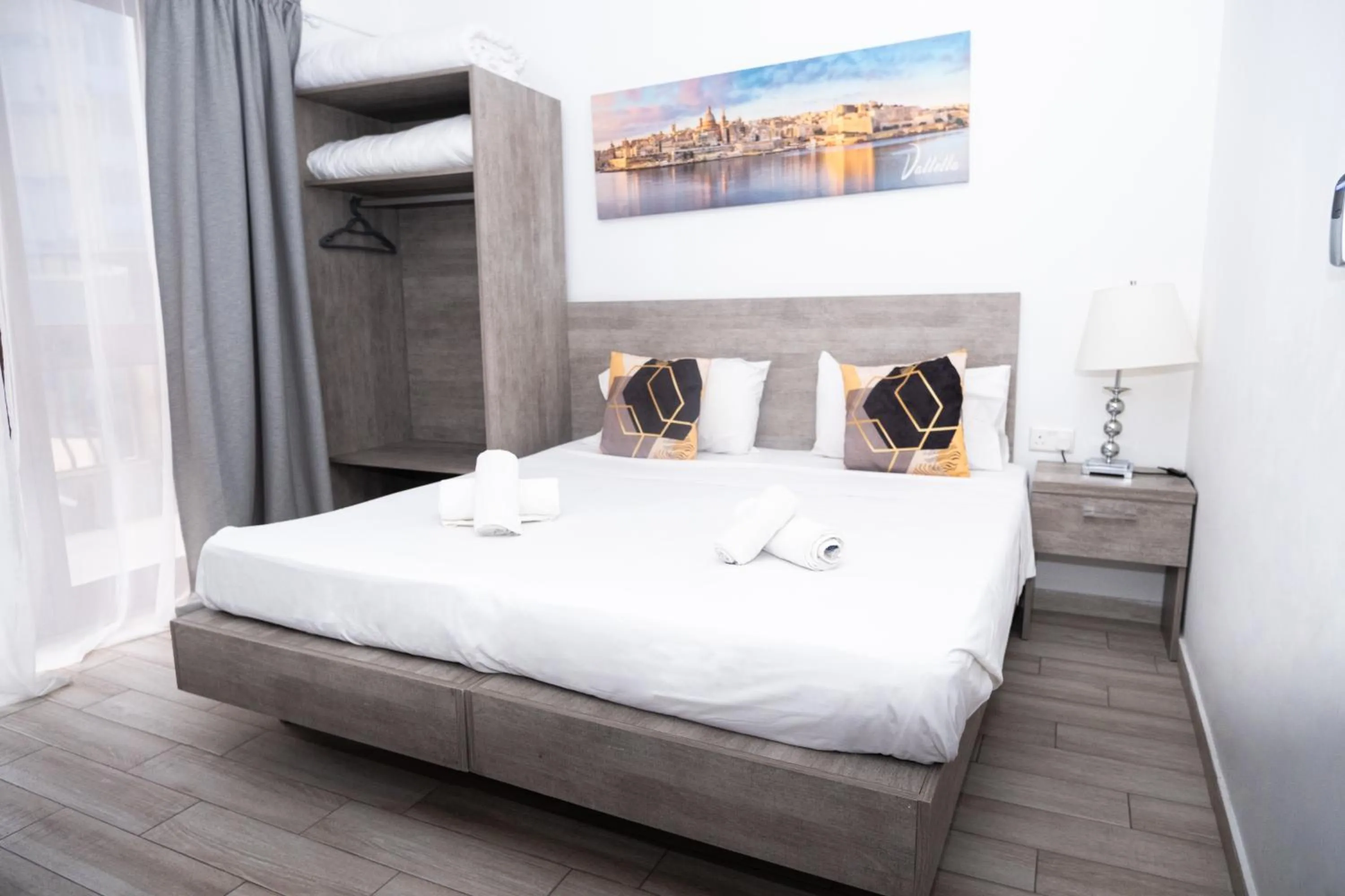 Bed in Napoli Suites Studios Aparthotel