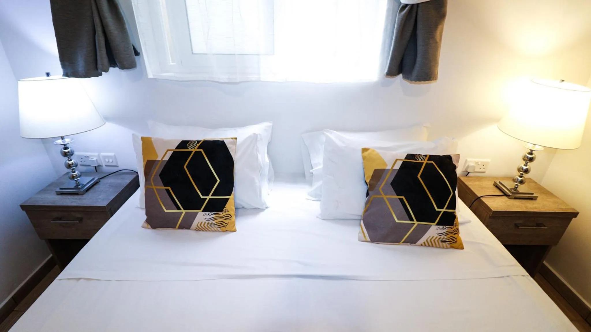 Bed in Napoli Suites Studios Aparthotel