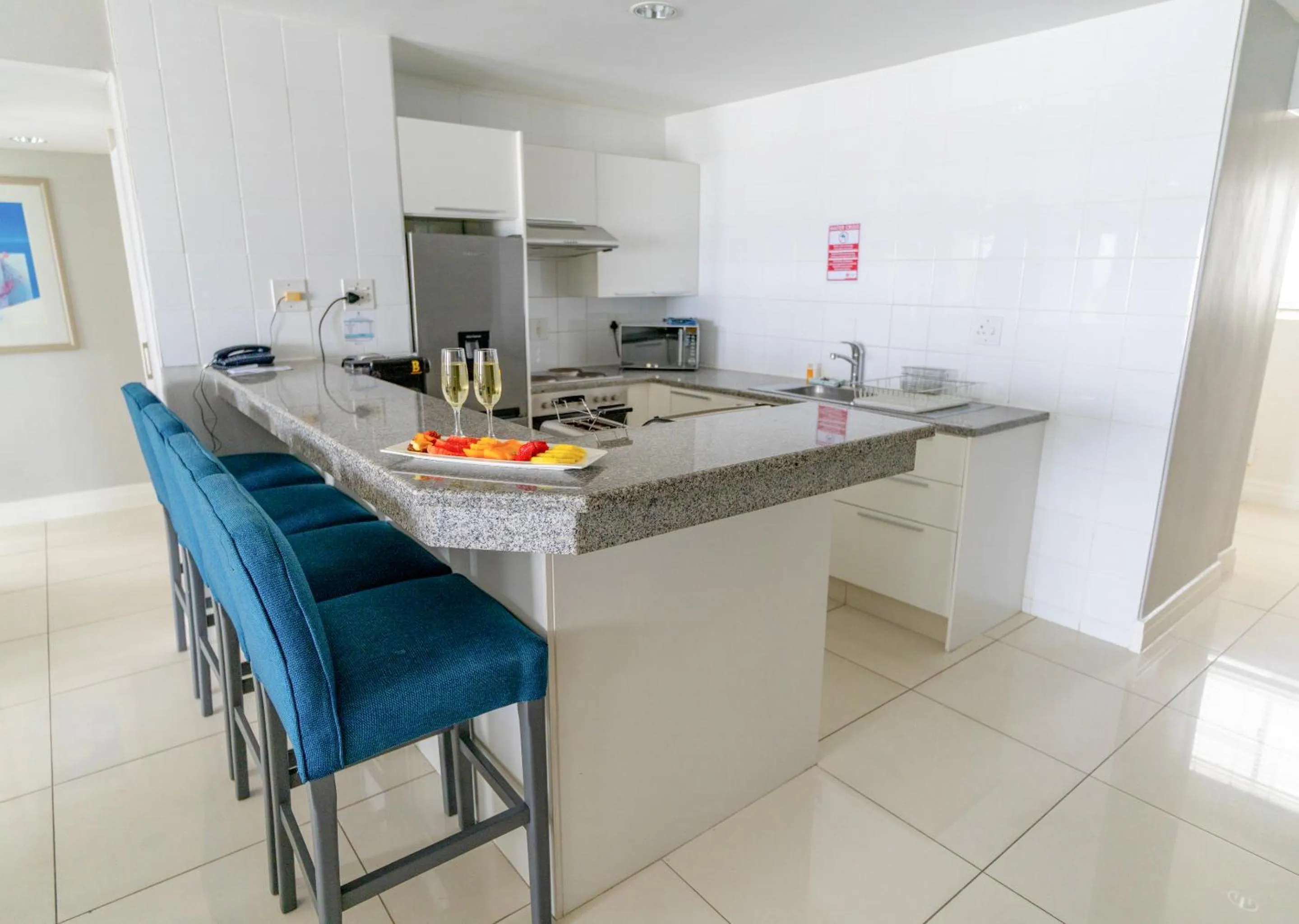Kitchen or kitchenette in Peninsula All Suite Hotel by Dream Resorts