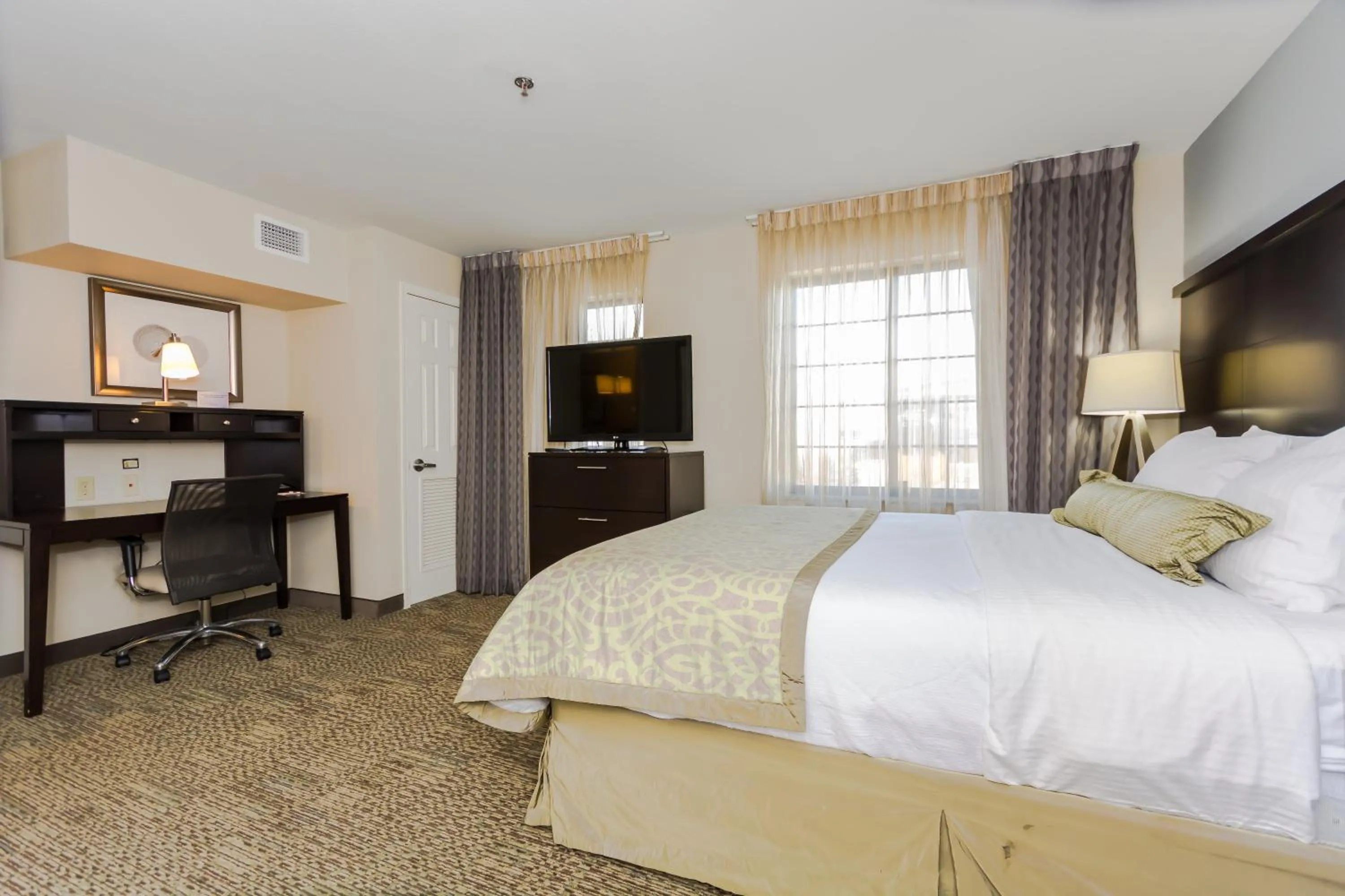 Photo of the whole room, Bed in Staybridge Suites Grand Forks by IHG