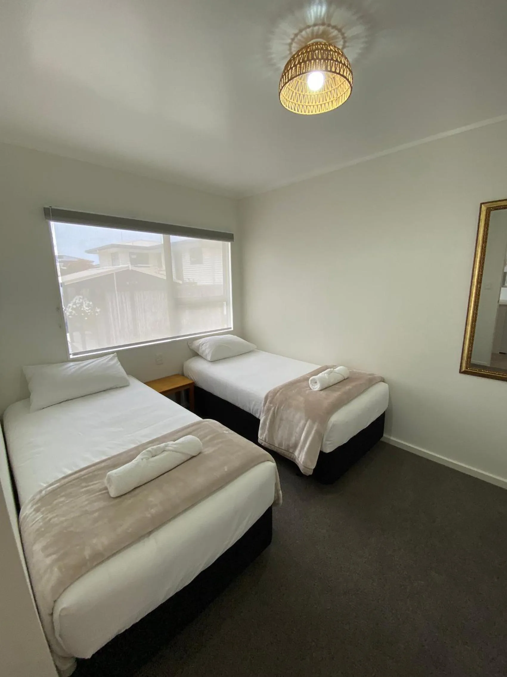 Bed in Opononi Lighthouse Motel