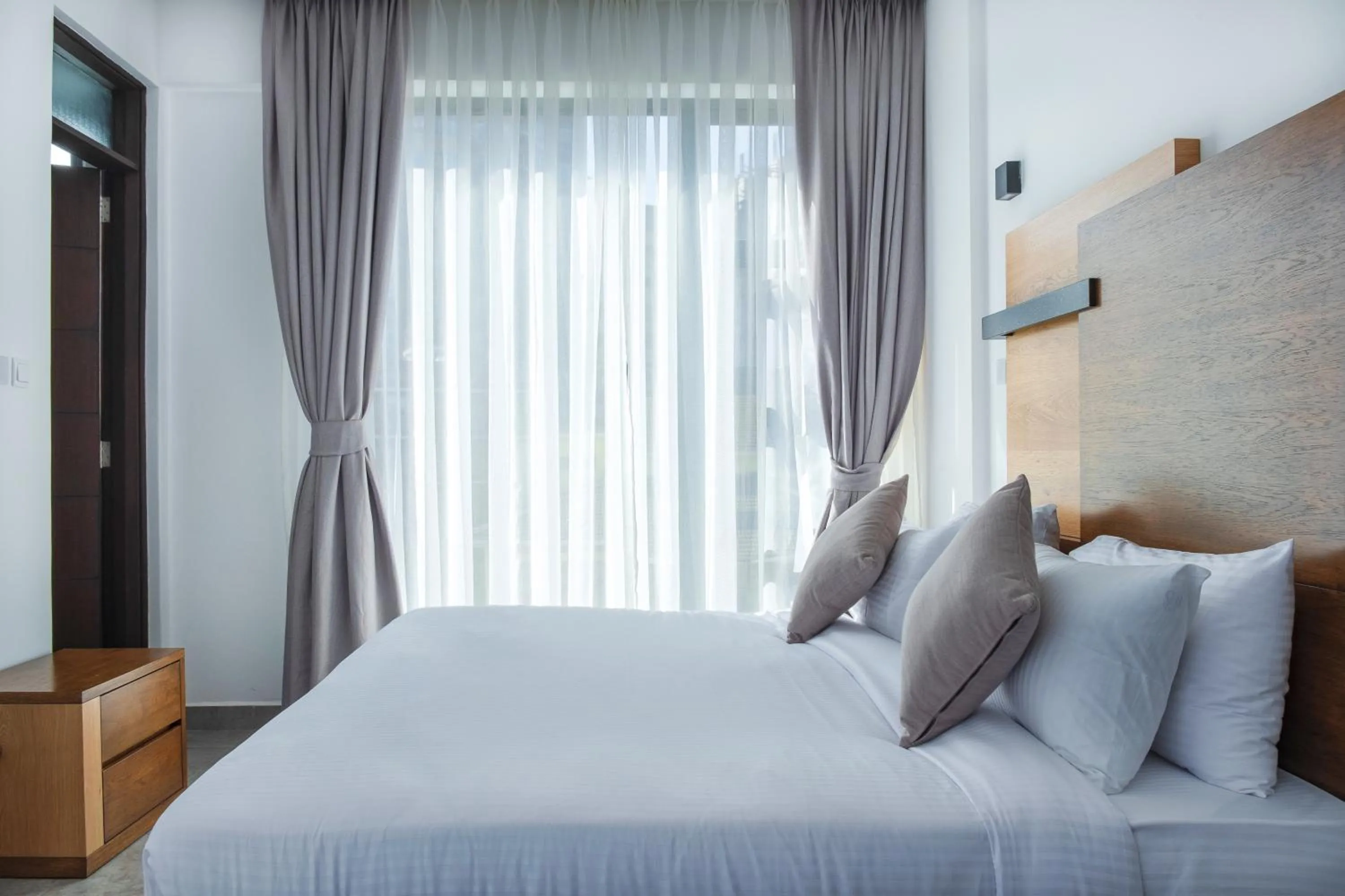 Bed in L'Aziz Suites - Near Aga Khan Hospital