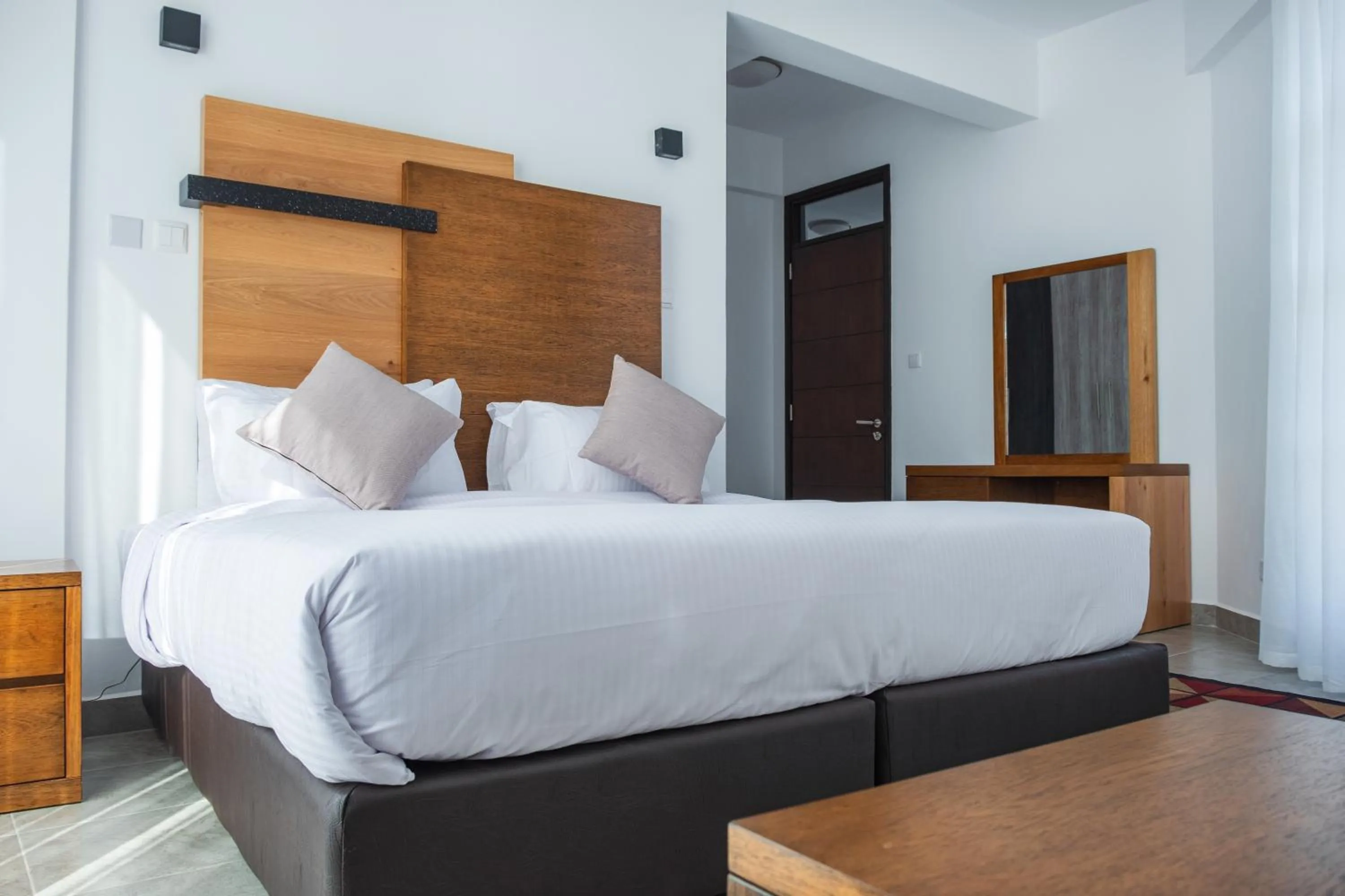 Bed in L'Aziz Suites - Near Aga Khan Hospital