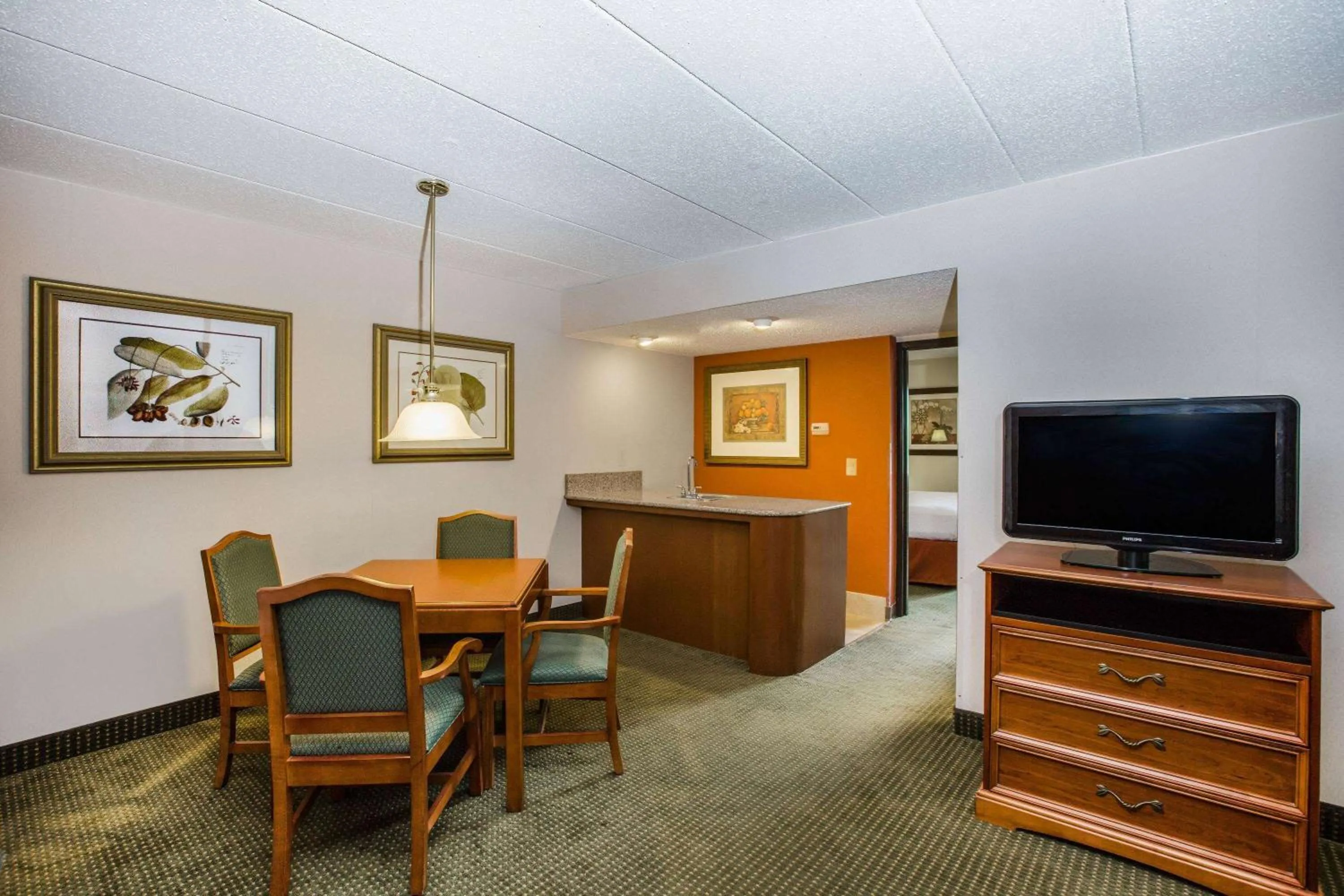 Living room in AmericInn by Wyndham Omaha