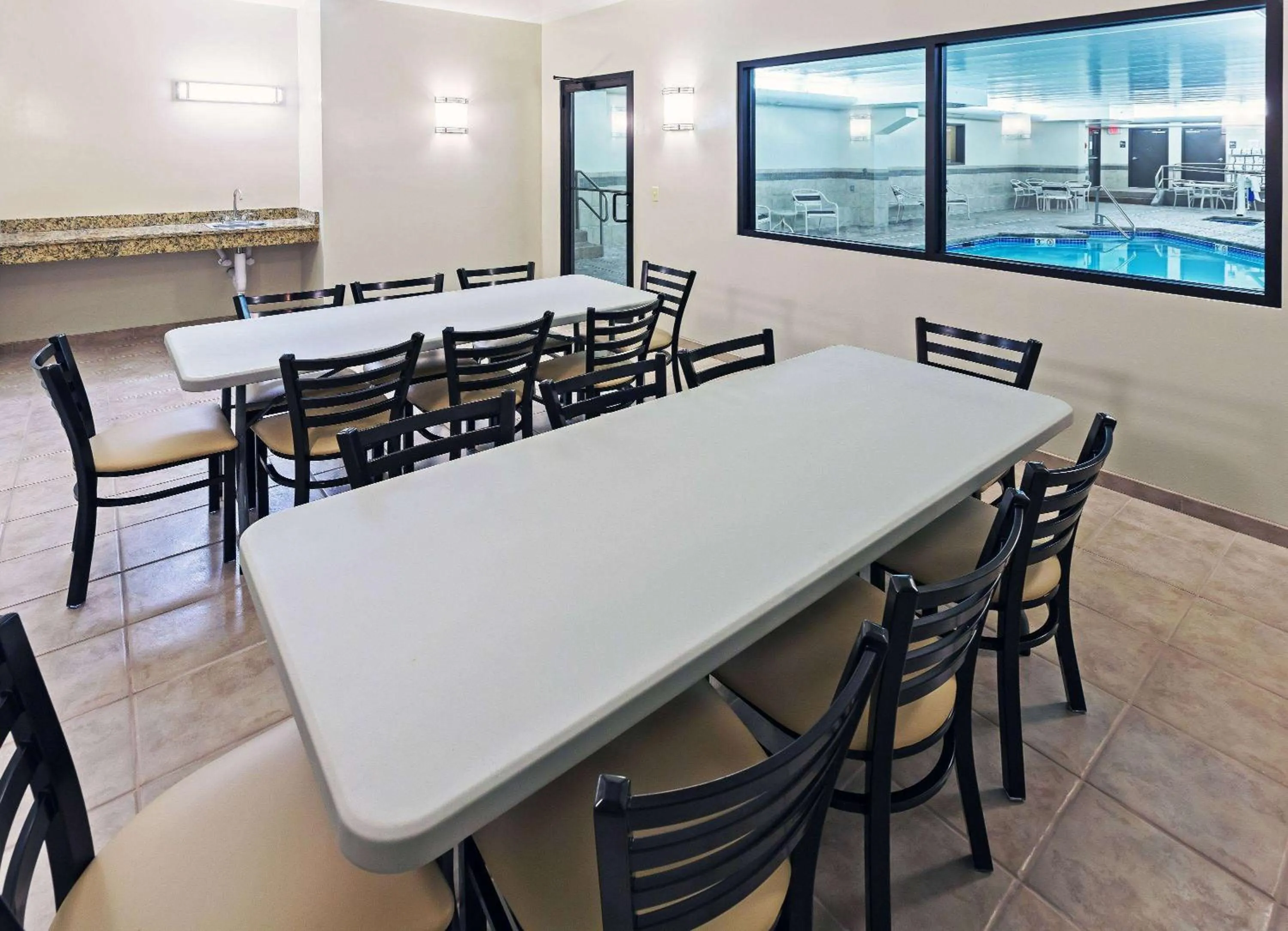 Swimming pool in AmericInn by Wyndham Omaha