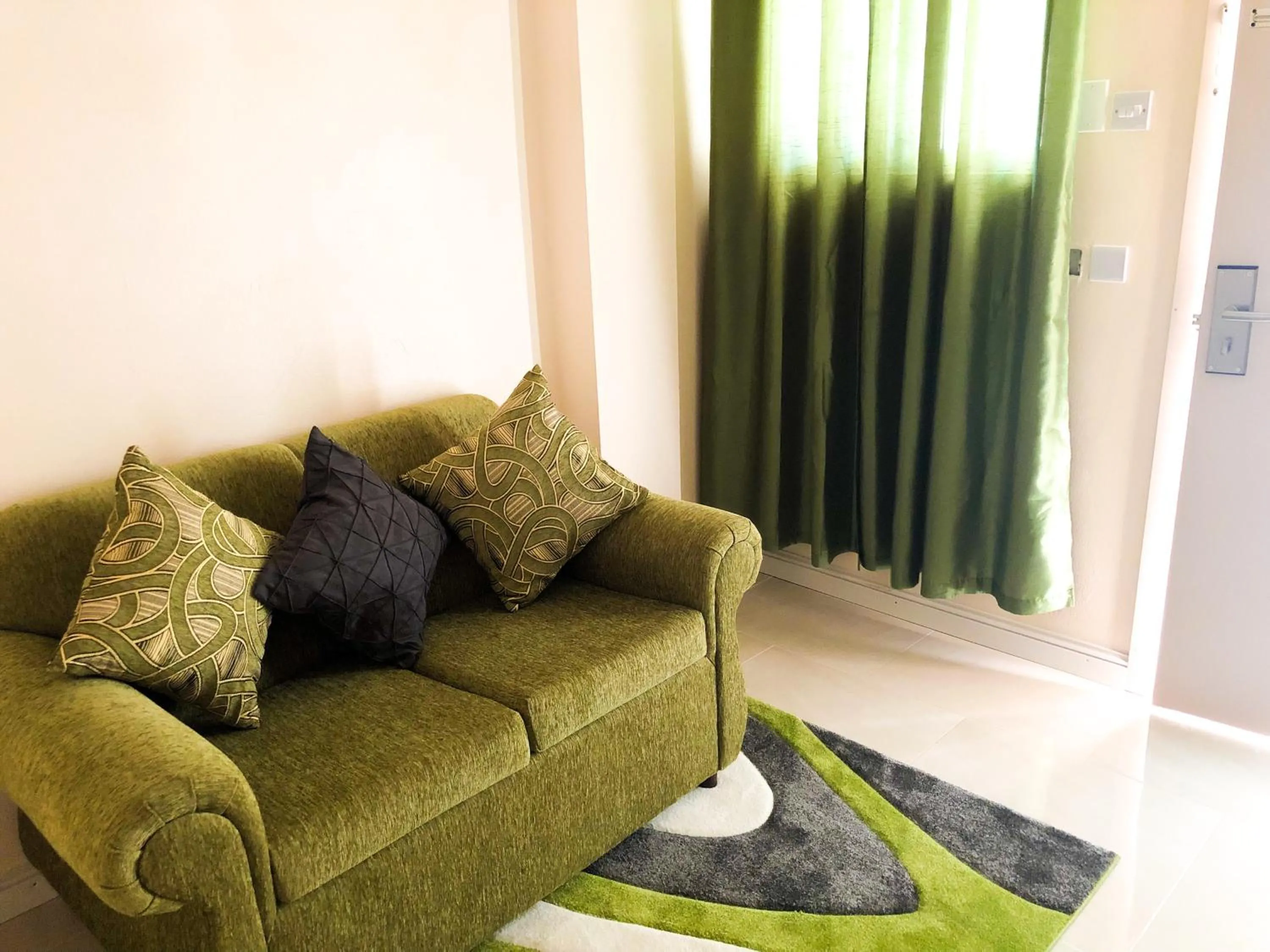 Deluxe Double Room with Balcony in Calliandras Apartment Complex