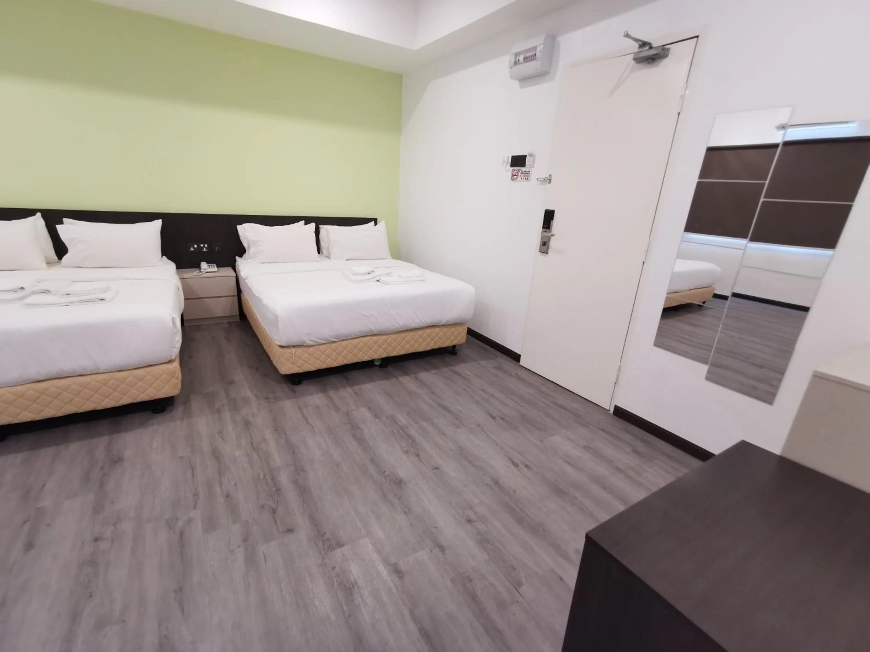 Bed in TT Dorf Hotel Matang