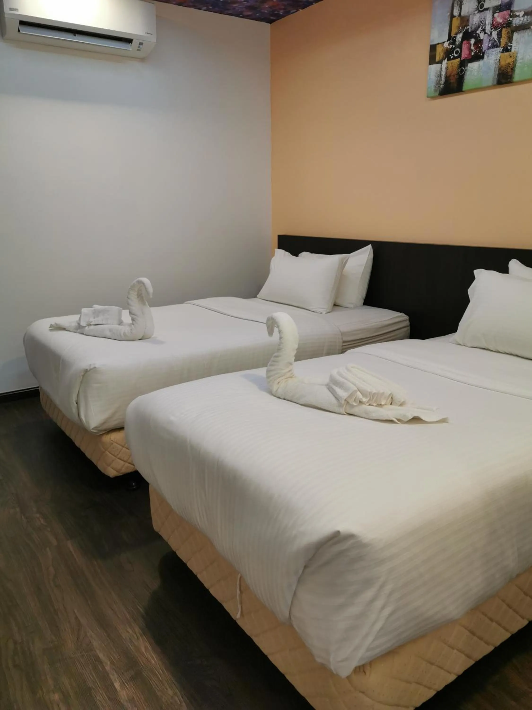 Bed in TT Dorf Hotel Matang