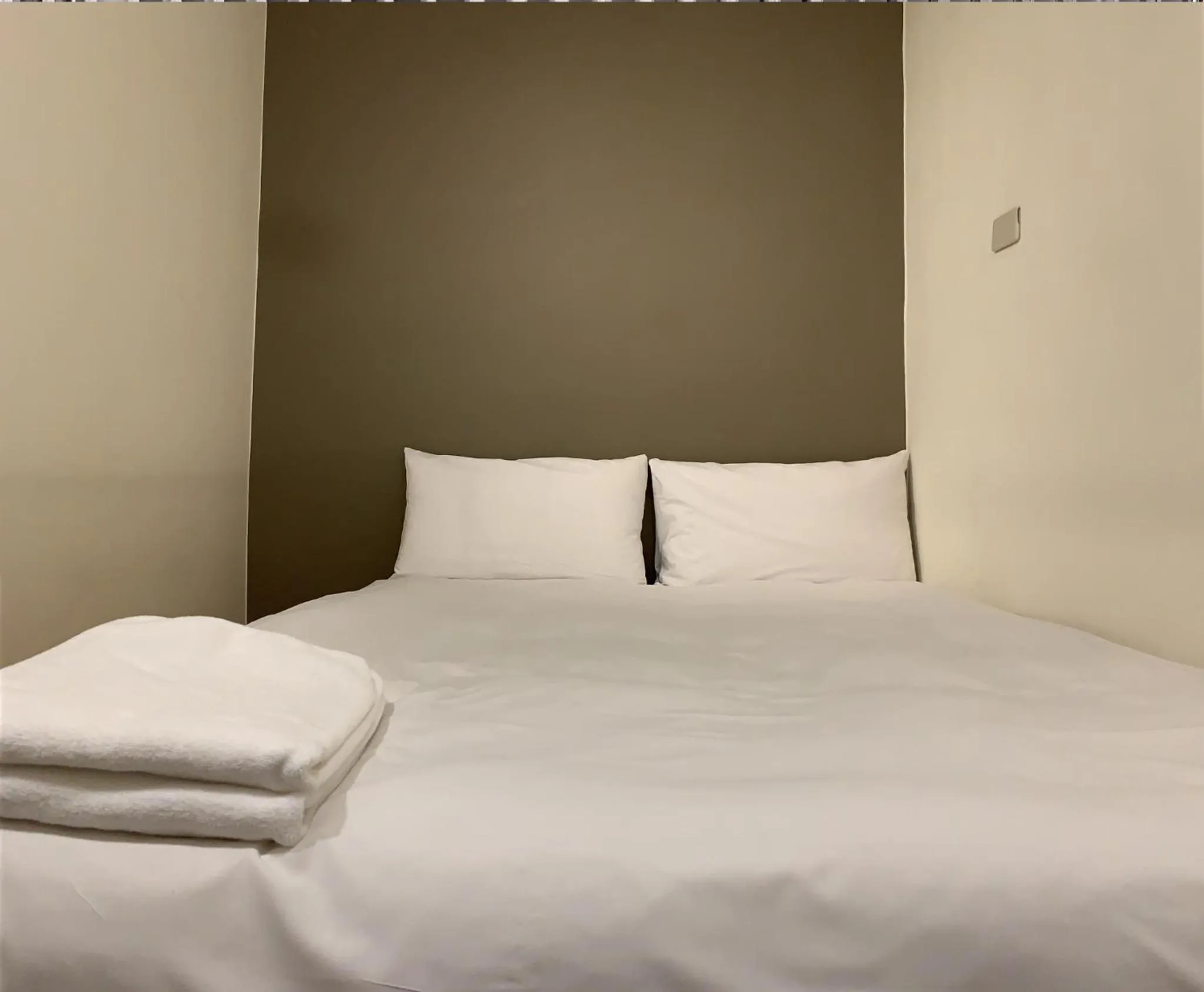 Bed in Raise Hotel Taichung