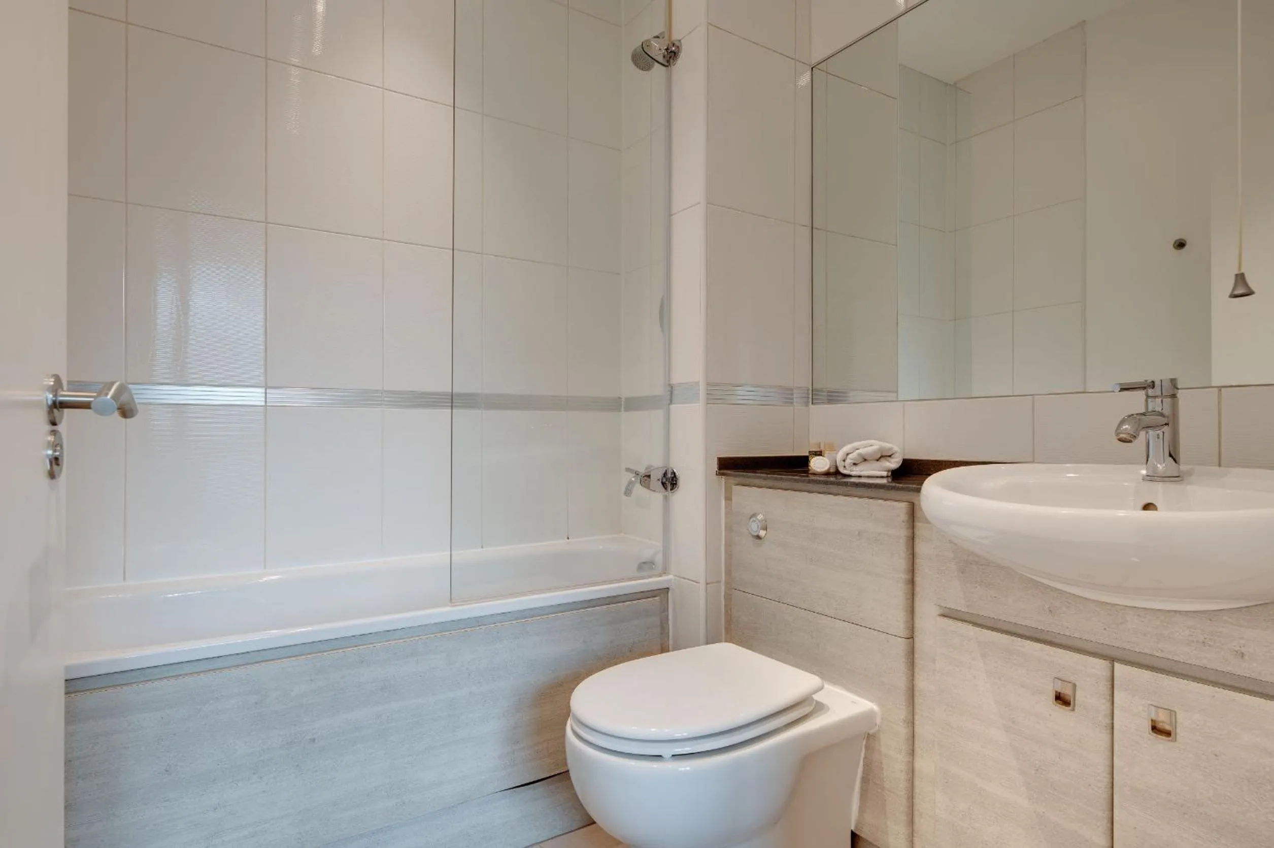 Bathroom in Crown Apartments 1C by Week2Week