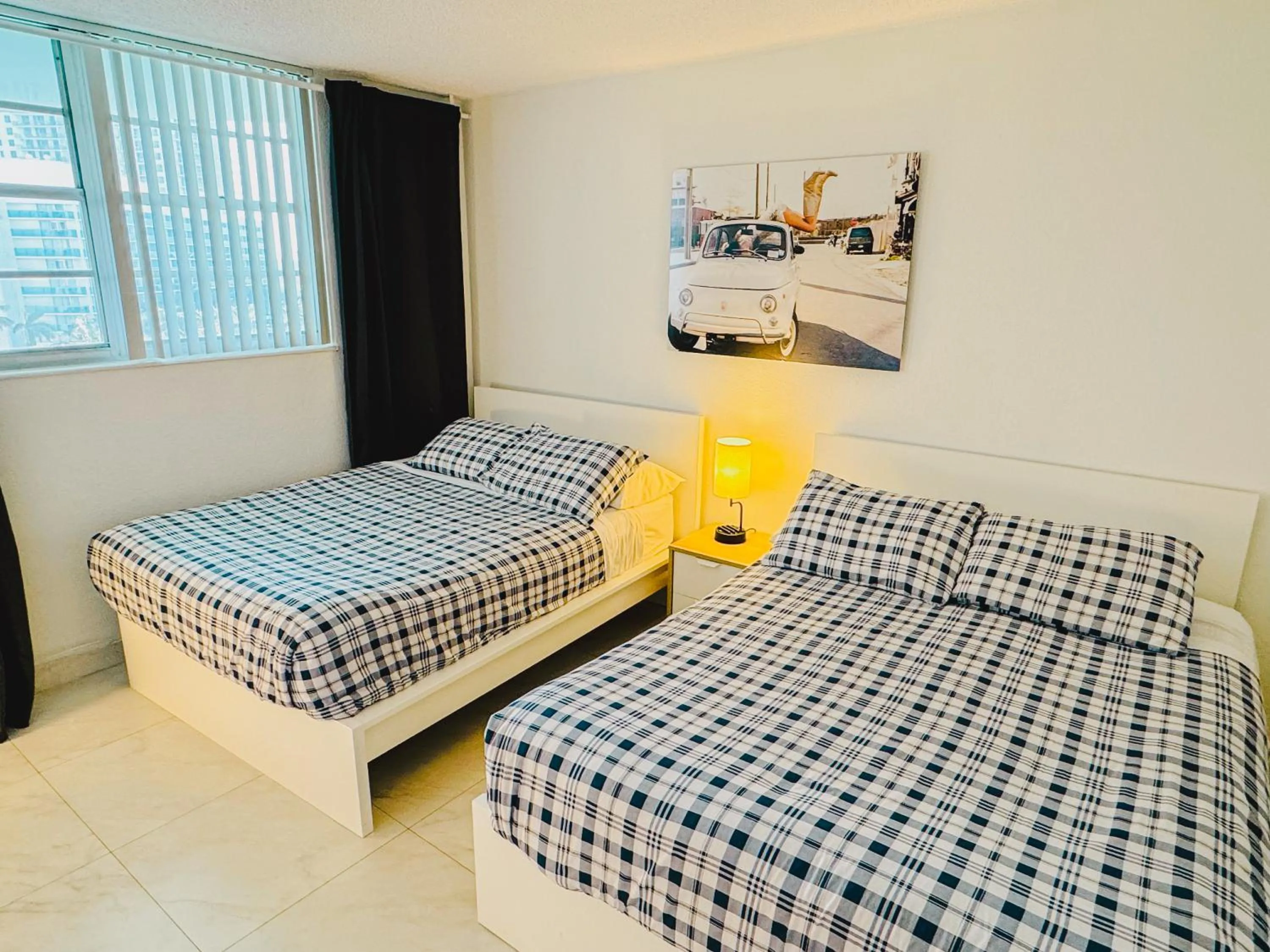 Bed in Miami Hallandale Condo, Partial Ocean View Direct Beach and Pool Access Miami Hollywood Beach