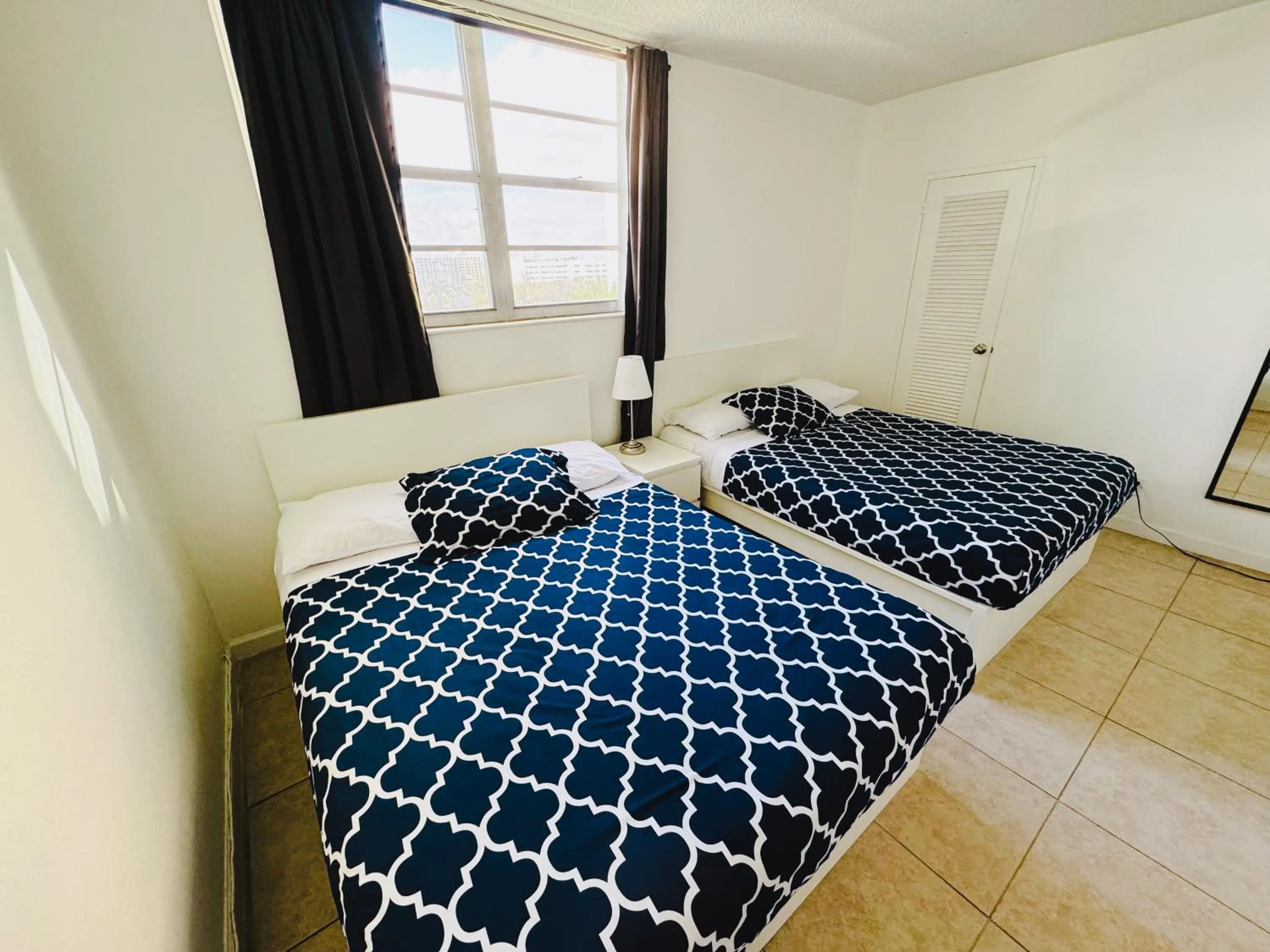 Bed in Miami Hallandale Condo, Partial Ocean View Direct Beach and Pool Access Miami Hollywood Beach