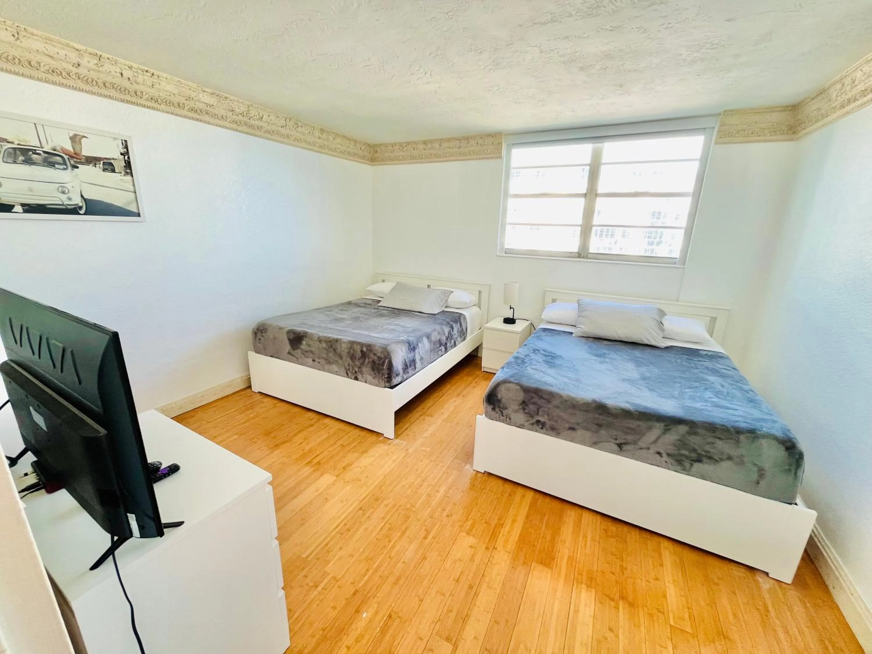 Bed in Miami Hallandale Condo, Partial Ocean View Direct Beach and Pool Access Miami Hollywood Beach