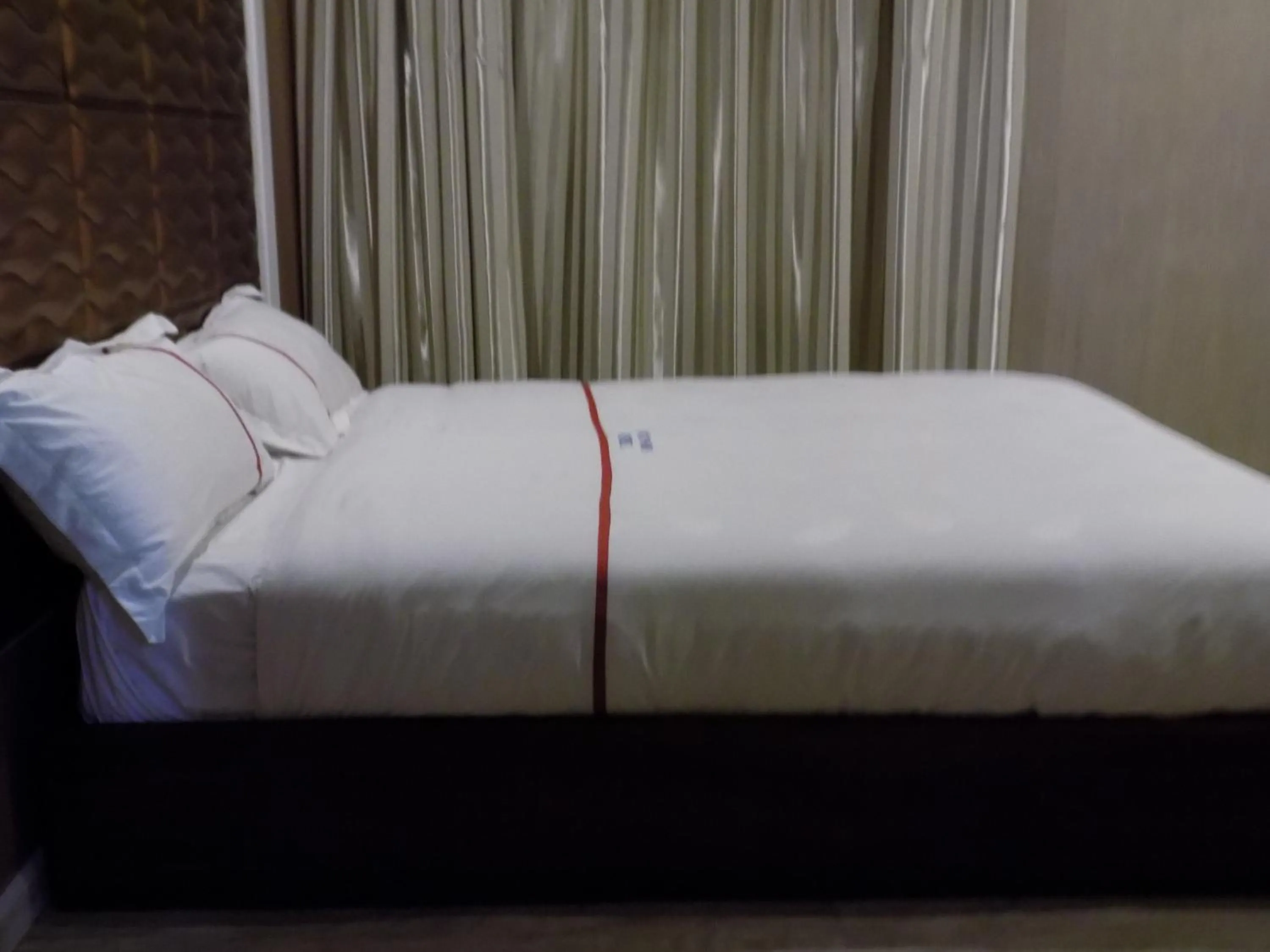 Bedroom in Freedom City Hotel Najjanankumbi Kamapala