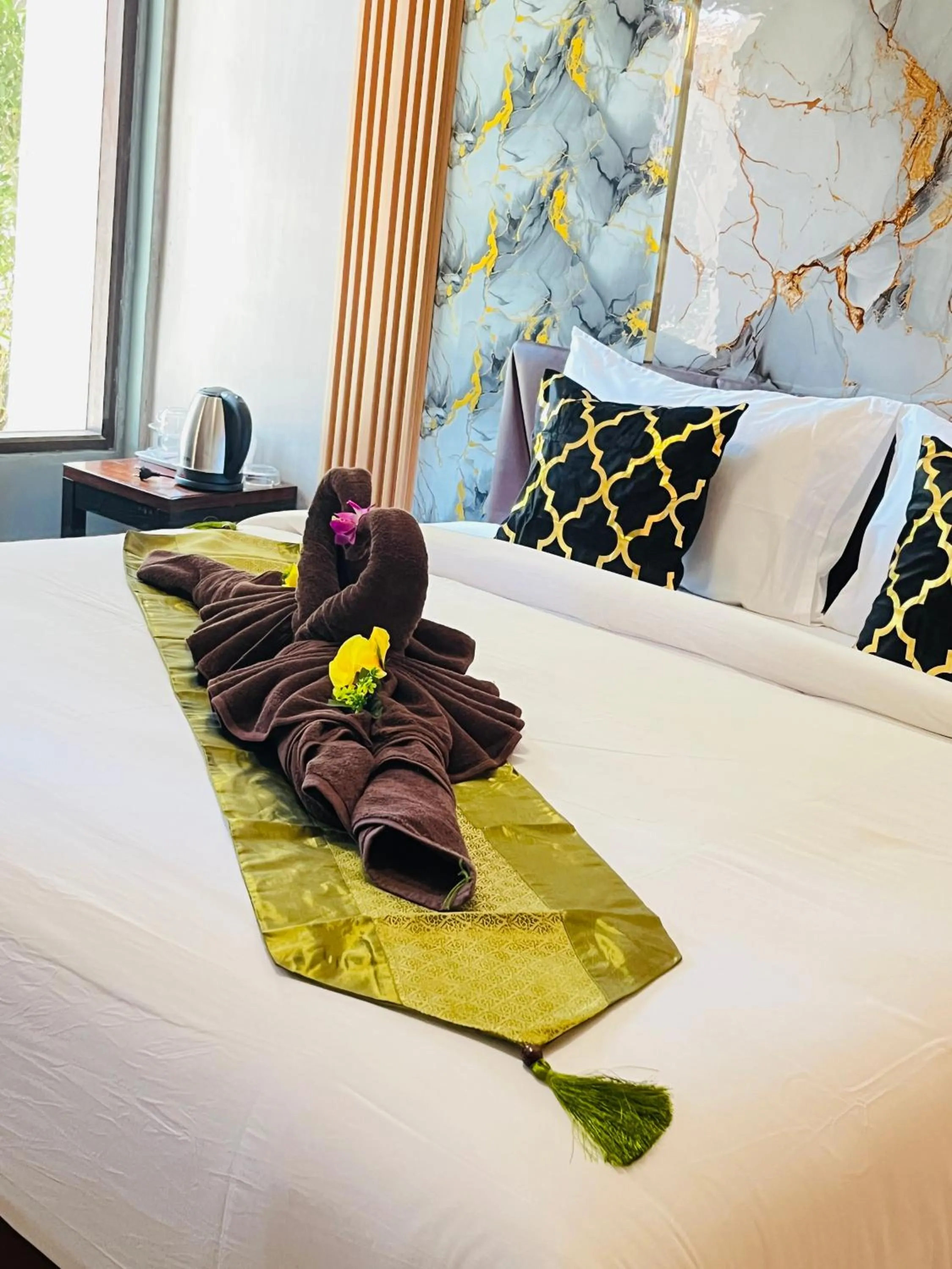 Bed in New Ozone Resort & Spa