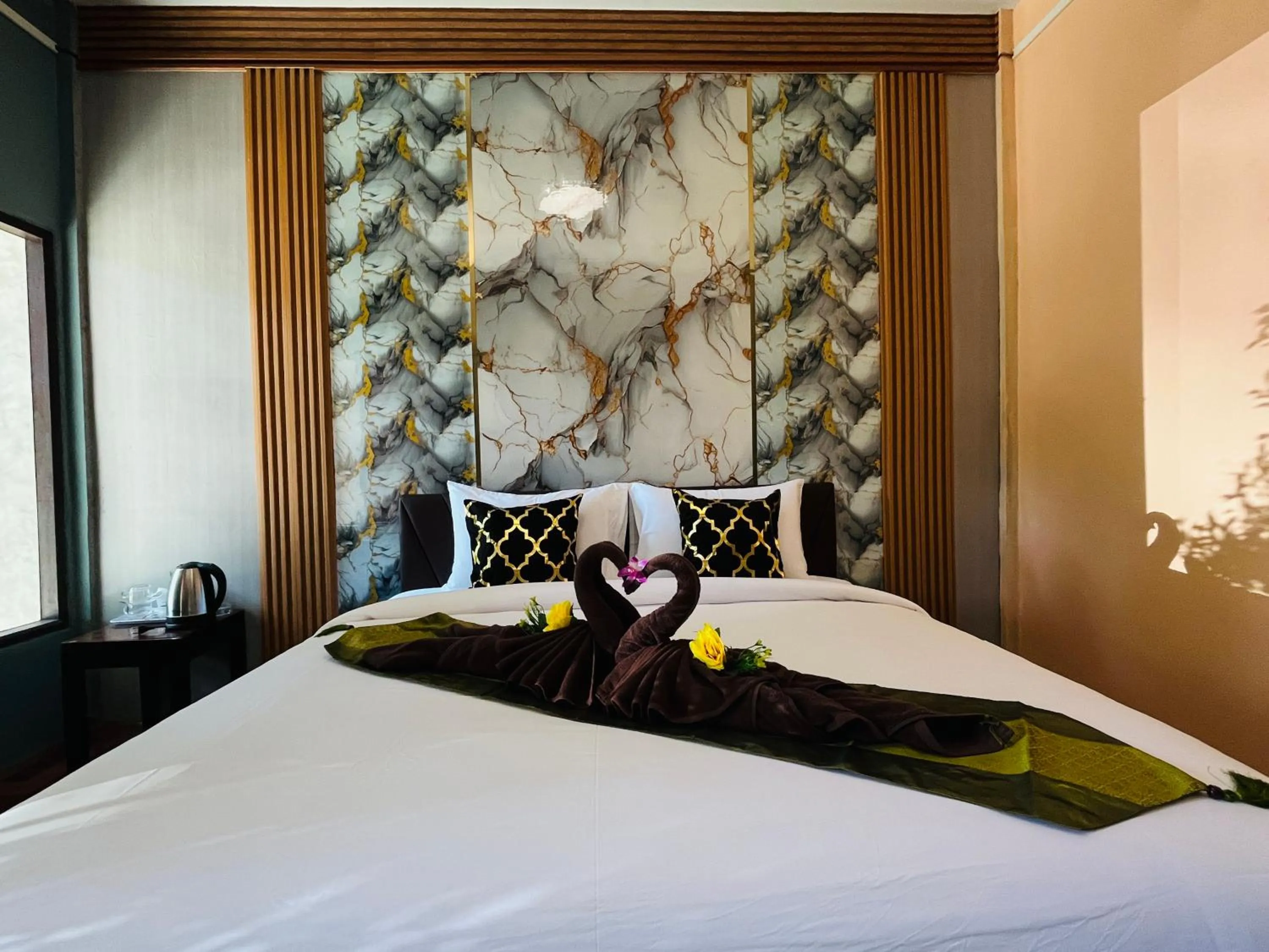 Bed in New Ozone Resort & Spa