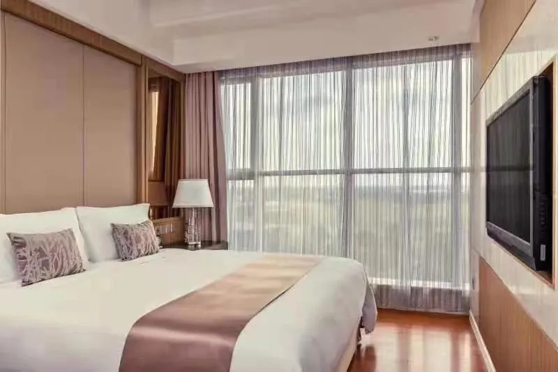 Bed in Crowne Plaza Shanghai Anting, an IHG Hotel