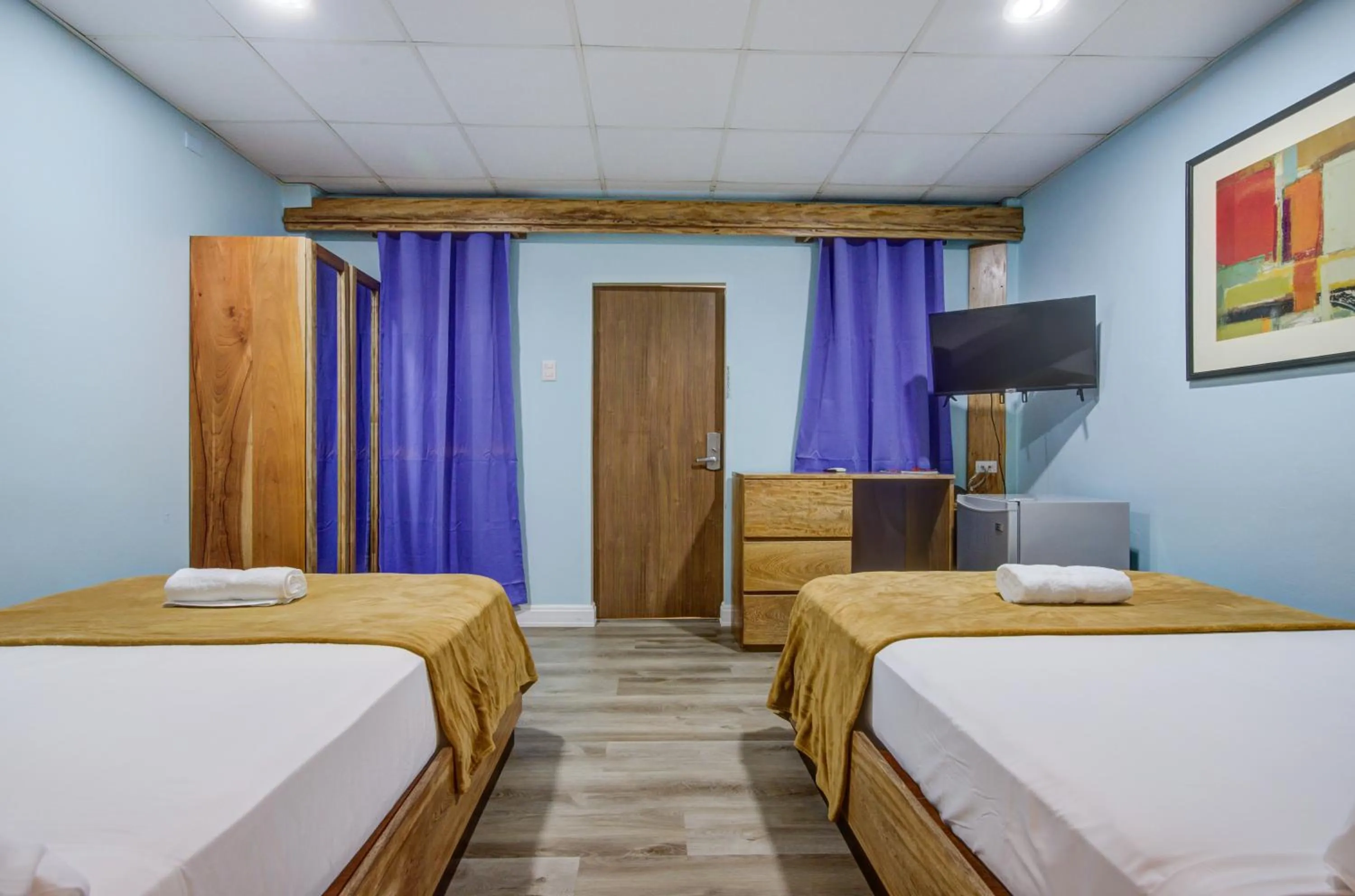 Bed in Airport Suites Hotel