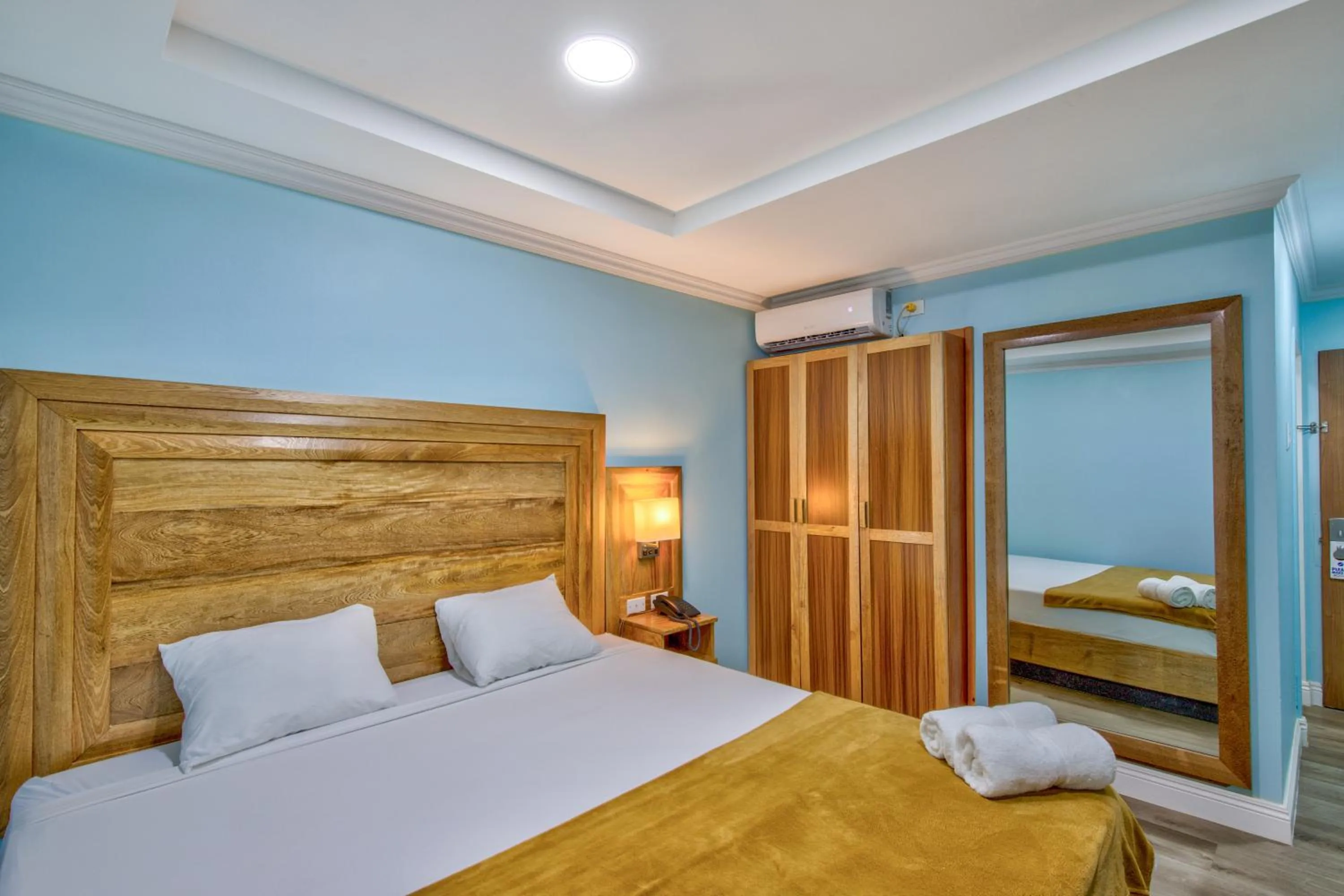 Bed in Airport Suites Hotel