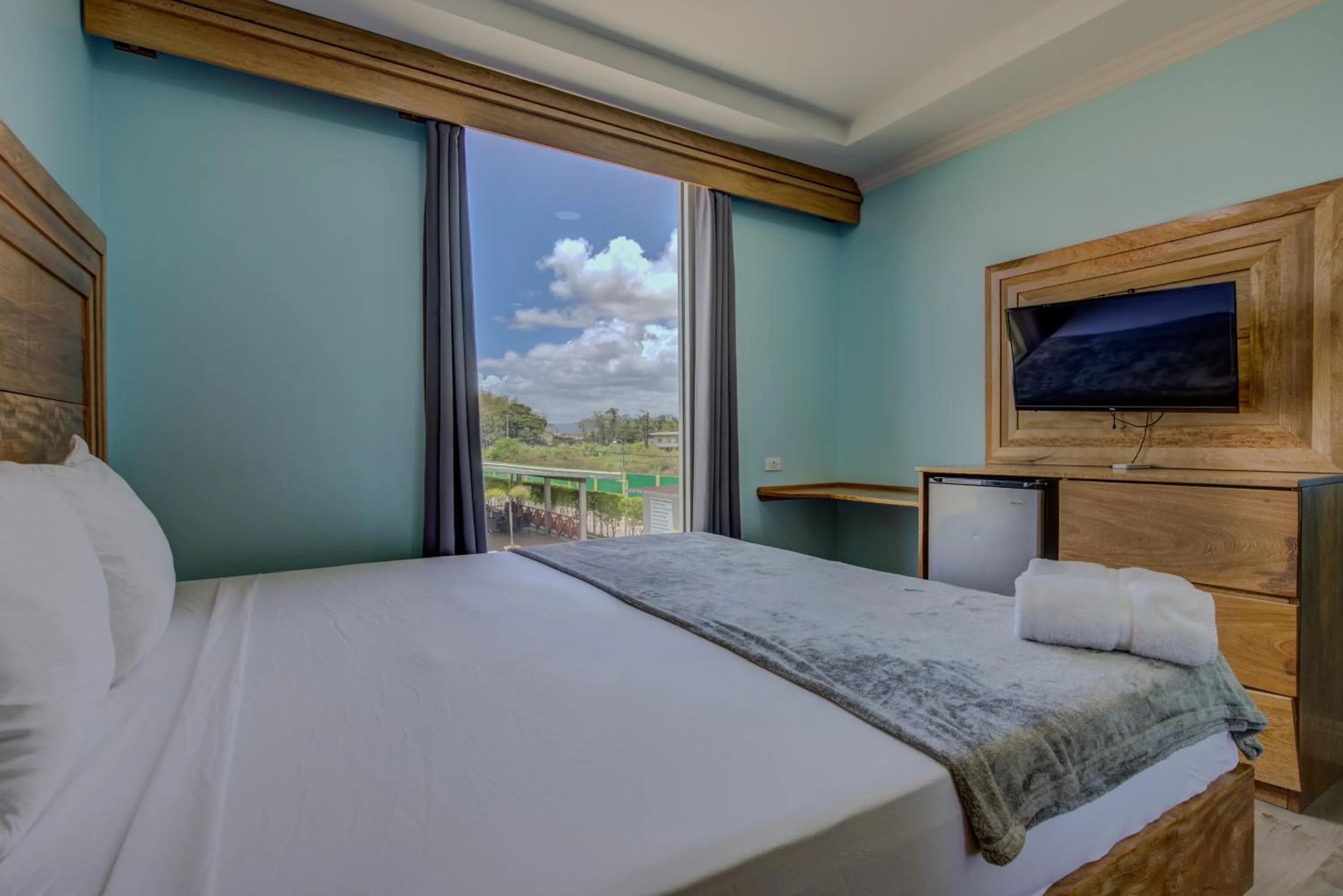 Bed in Airport Suites Hotel