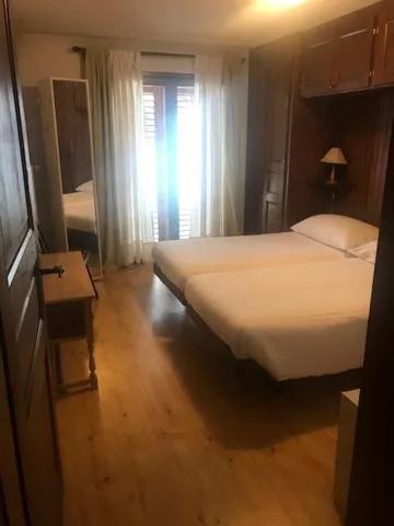 Bed in Hotel Mirabeau