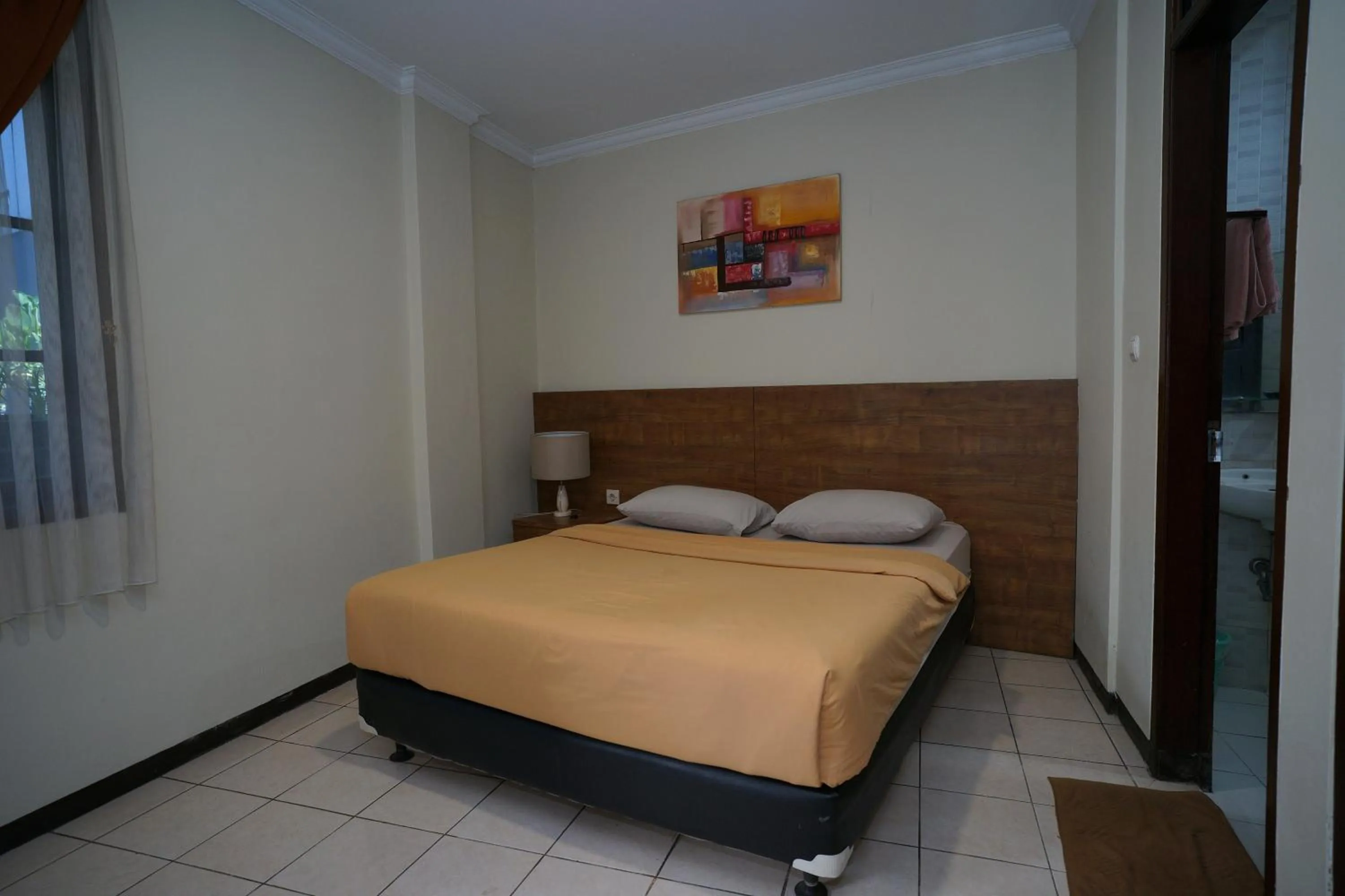 Bed in Hotel Puri Pangalengan