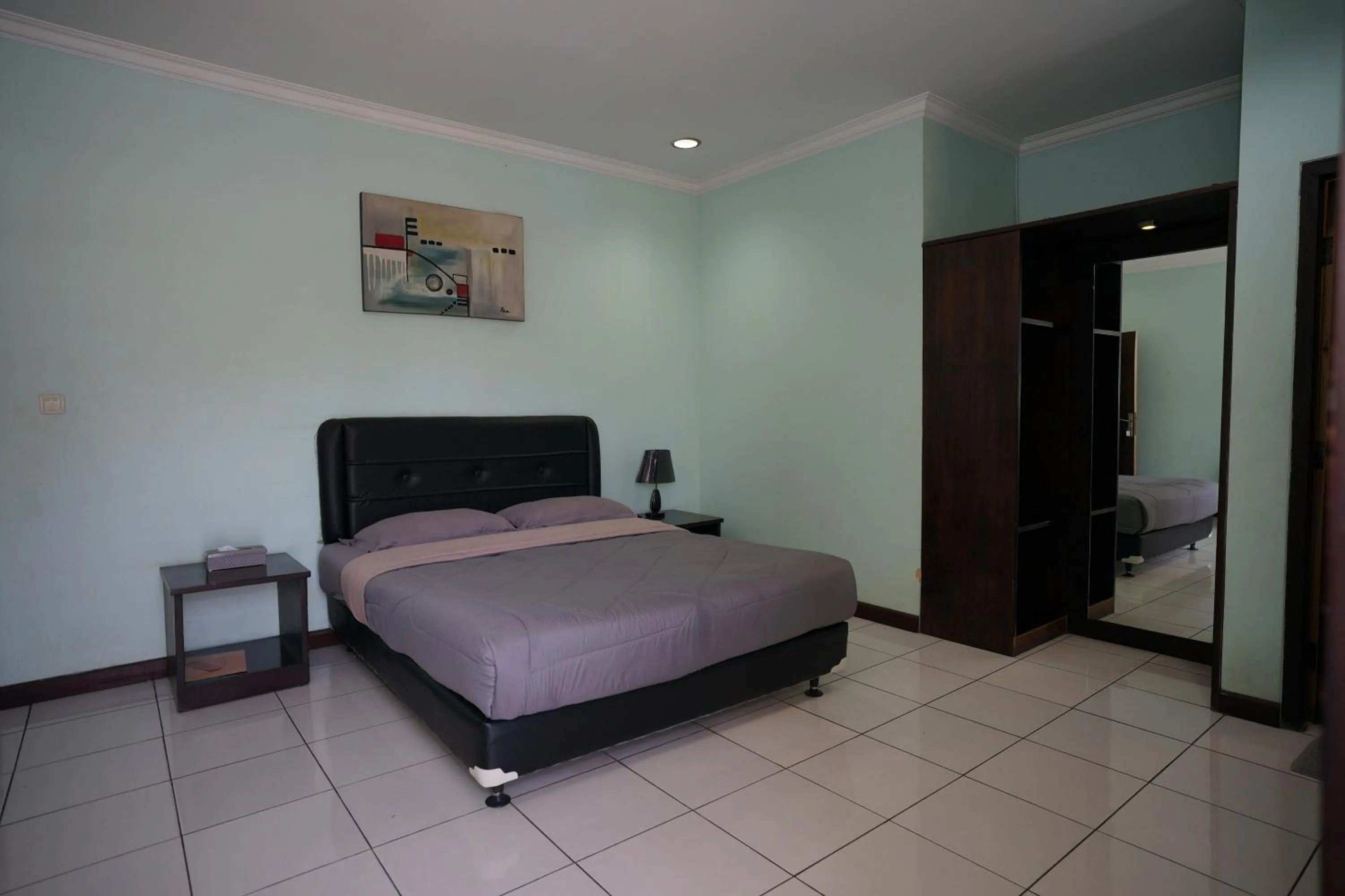 Bed in Hotel Puri Pangalengan