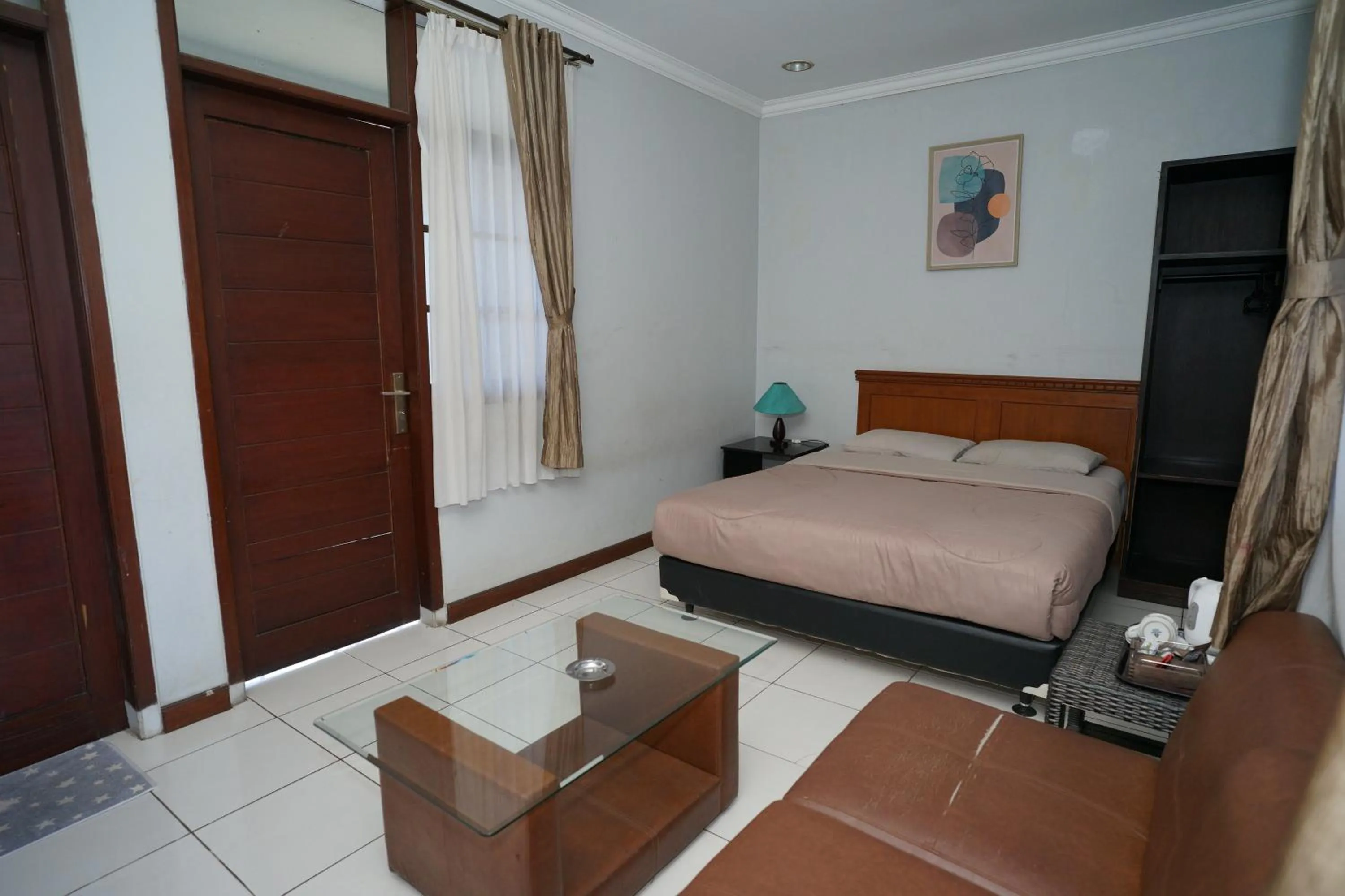 Bed in Hotel Puri Pangalengan