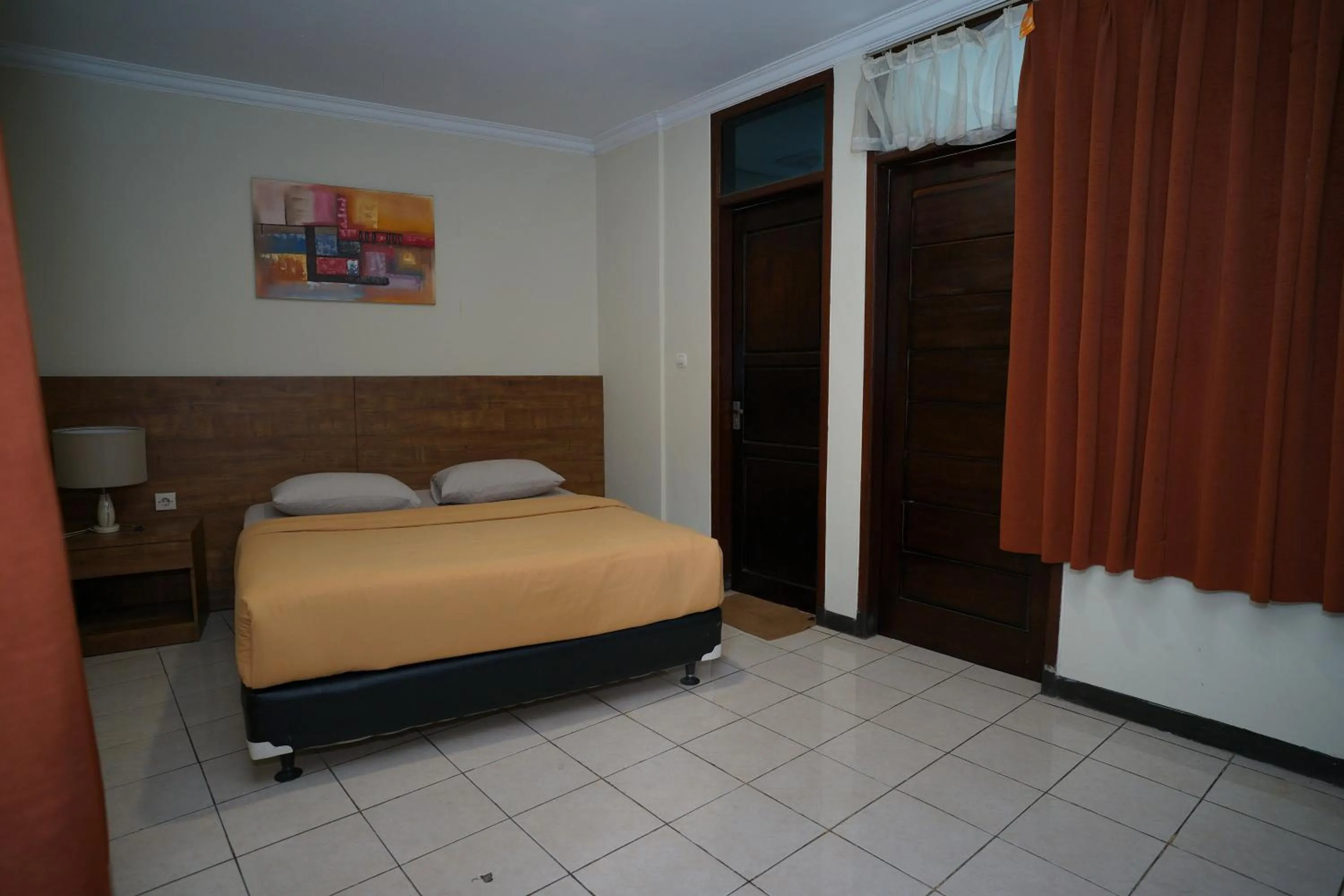 Bed in Hotel Puri Pangalengan