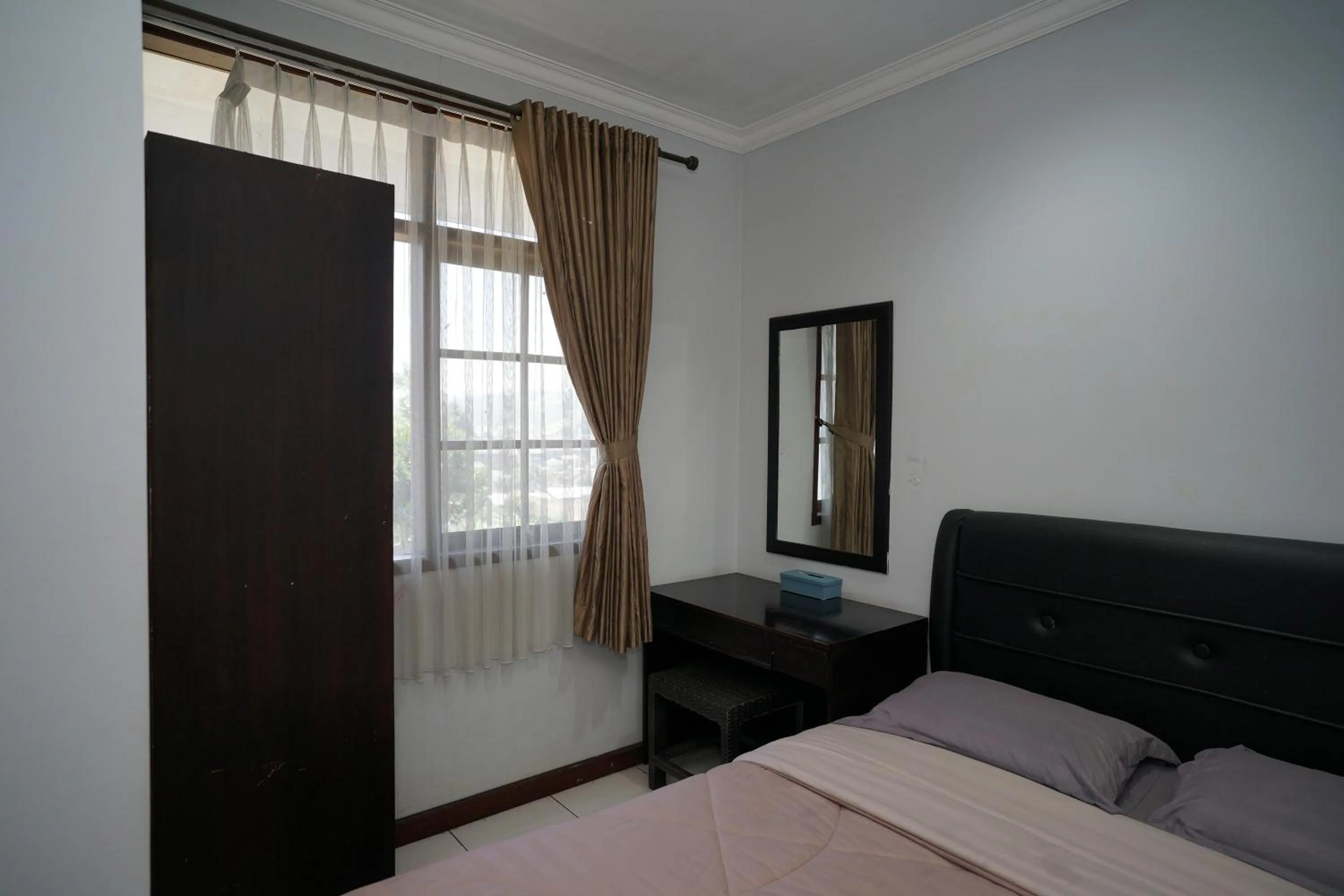 Bed in Hotel Puri Pangalengan