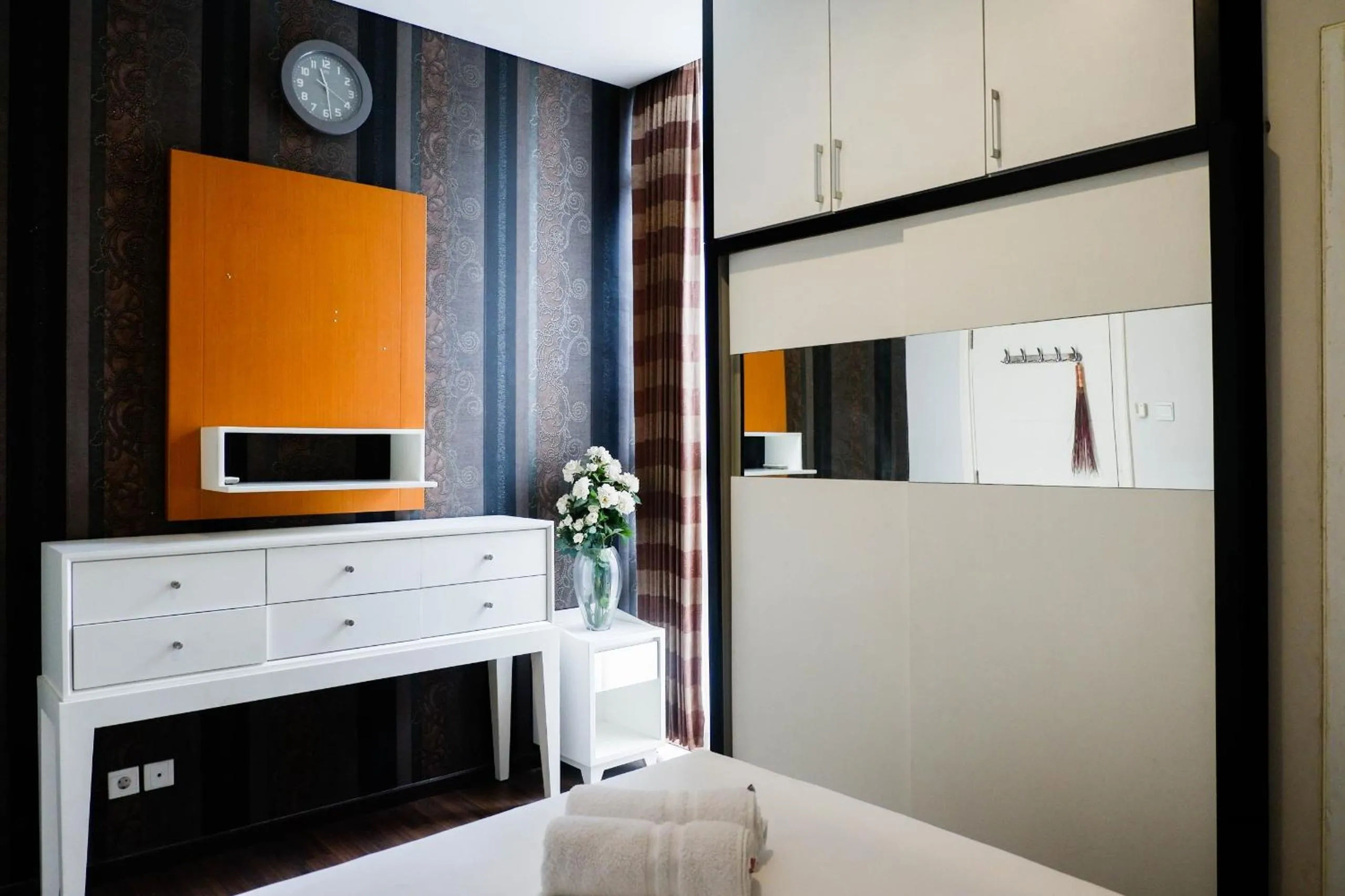 Bed in Strategic 2BR Apartment at Trillium Residence By Travelio