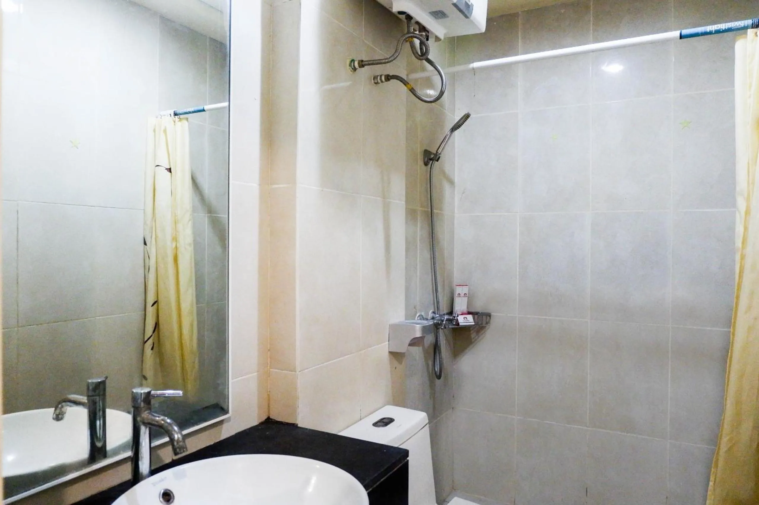 Bathroom in Strategic 2BR Apartment at Trillium Residence By Travelio