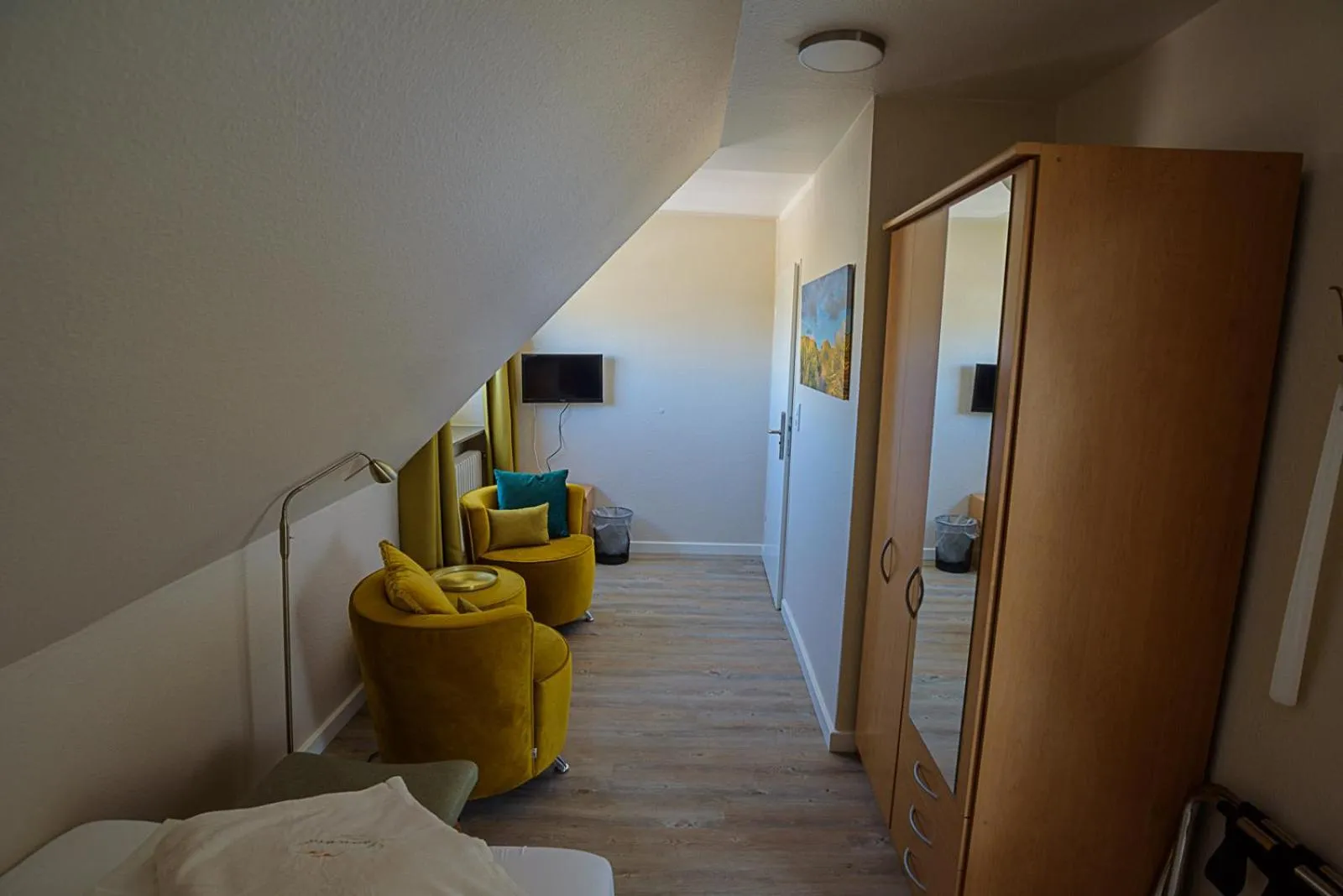 Seating area, Bed in Pension Luuward 3 Sterne superior Hotel