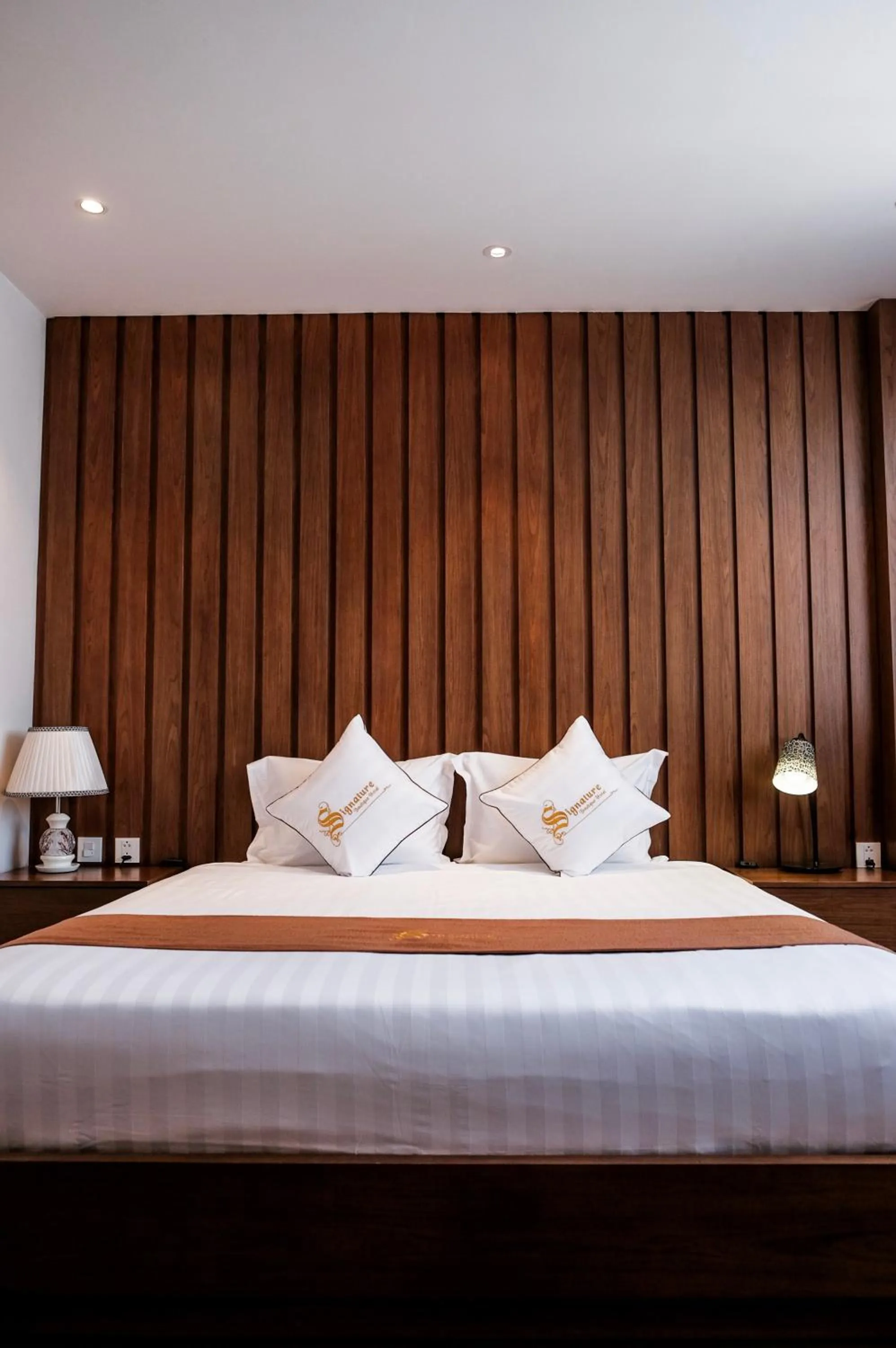 Bed in Signature Boutique Hotel