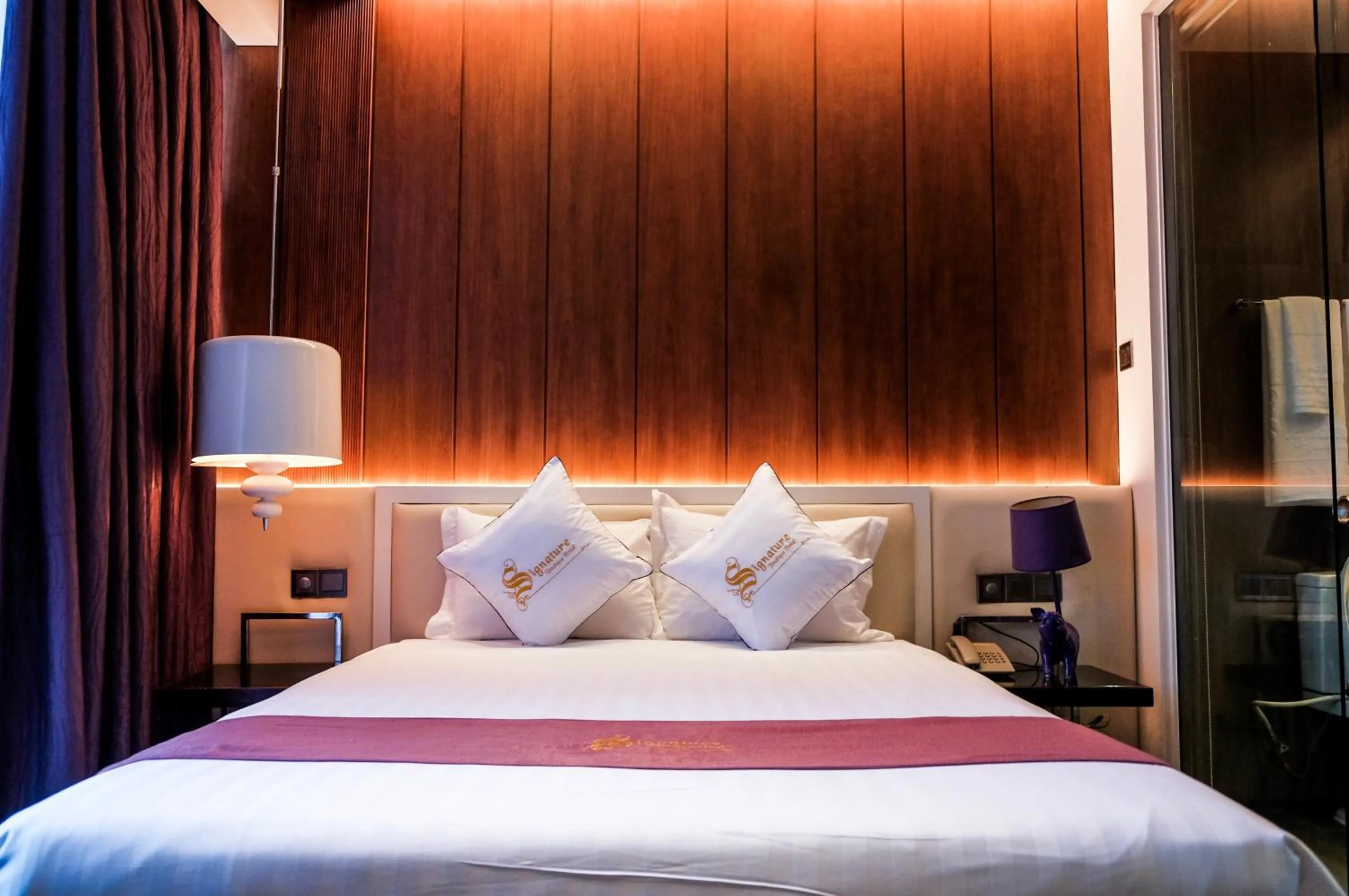 Bed in Signature Boutique Hotel