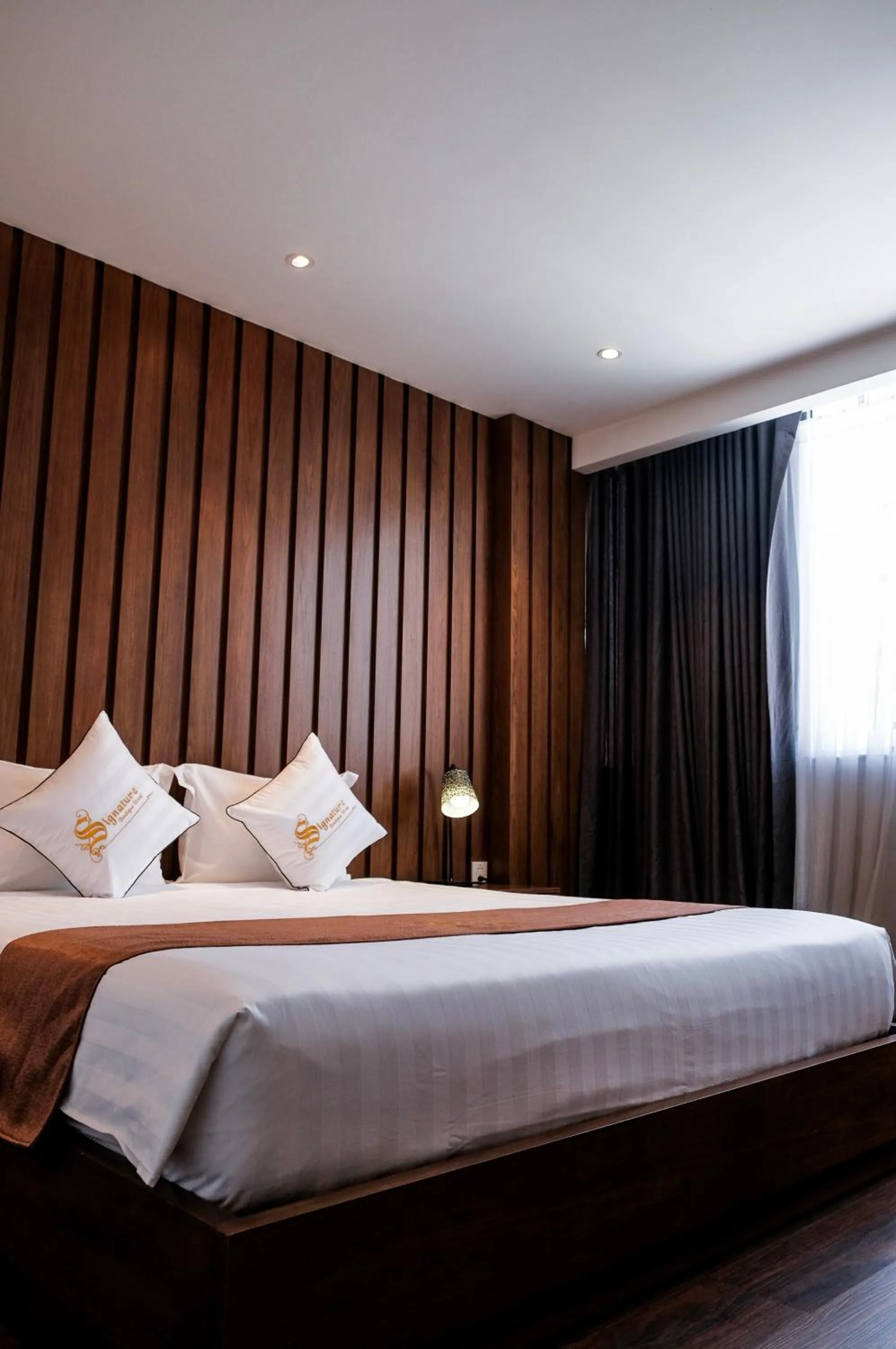 Bed in Signature Boutique Hotel